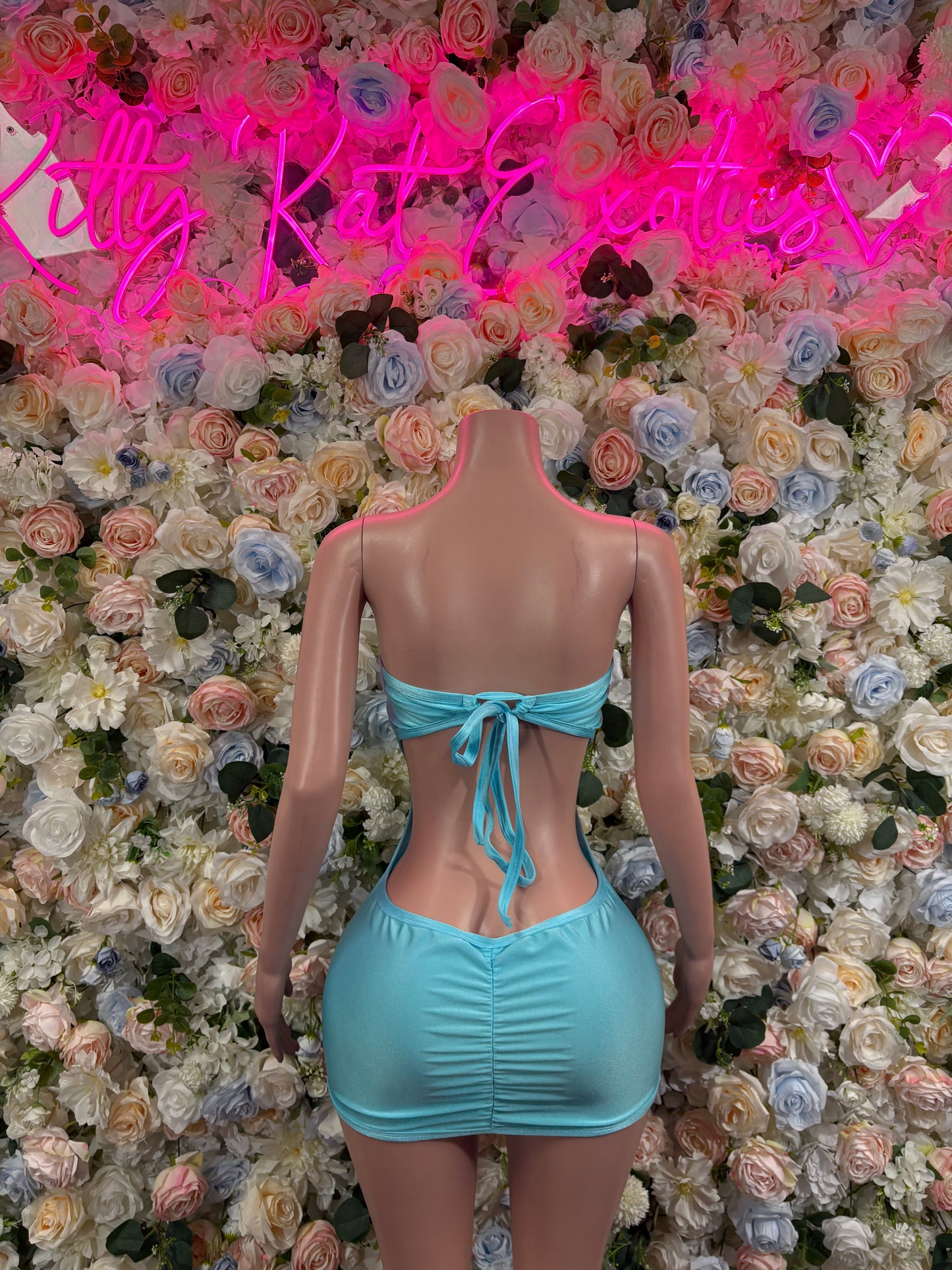 Turquoise one-piece dress with halter neckline and tie-front waist