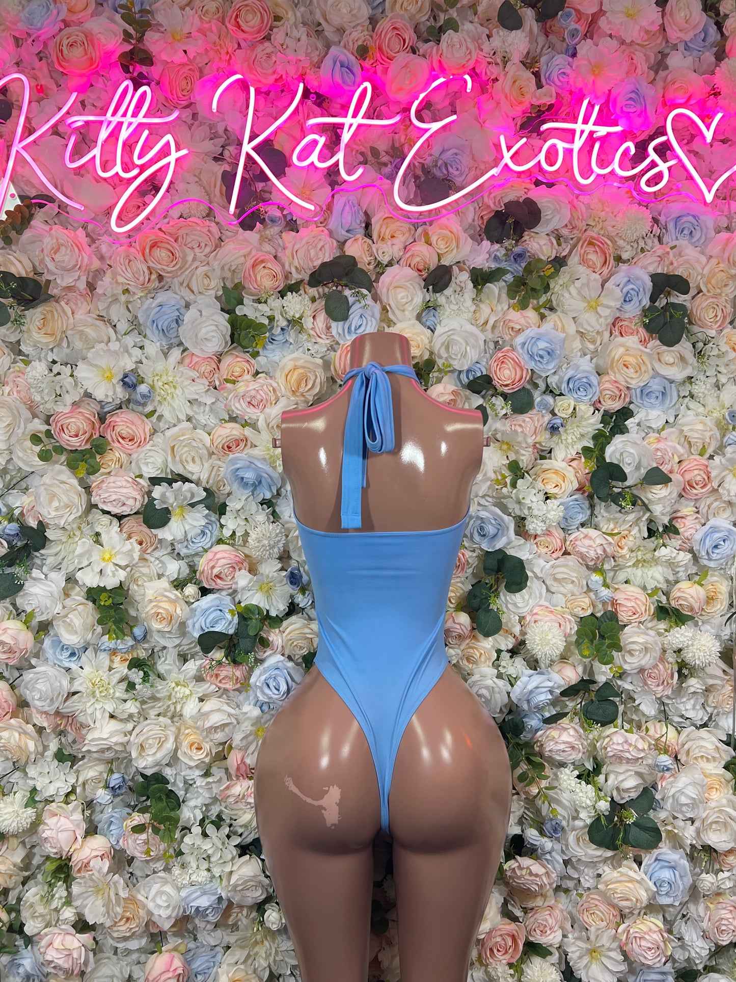 Light blue halter monokini bodysuit with tie-back and back cutout