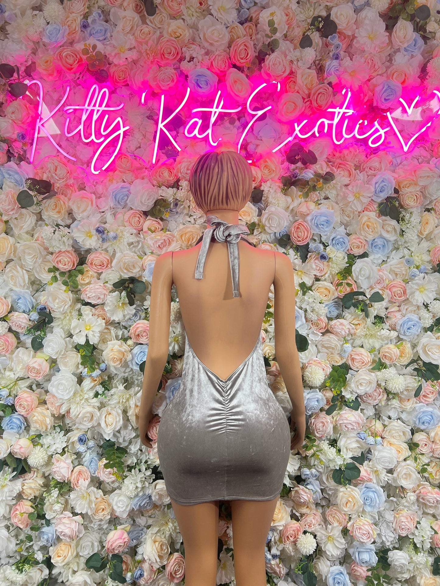 Silver velvet mini dress with open back and tied halter strap