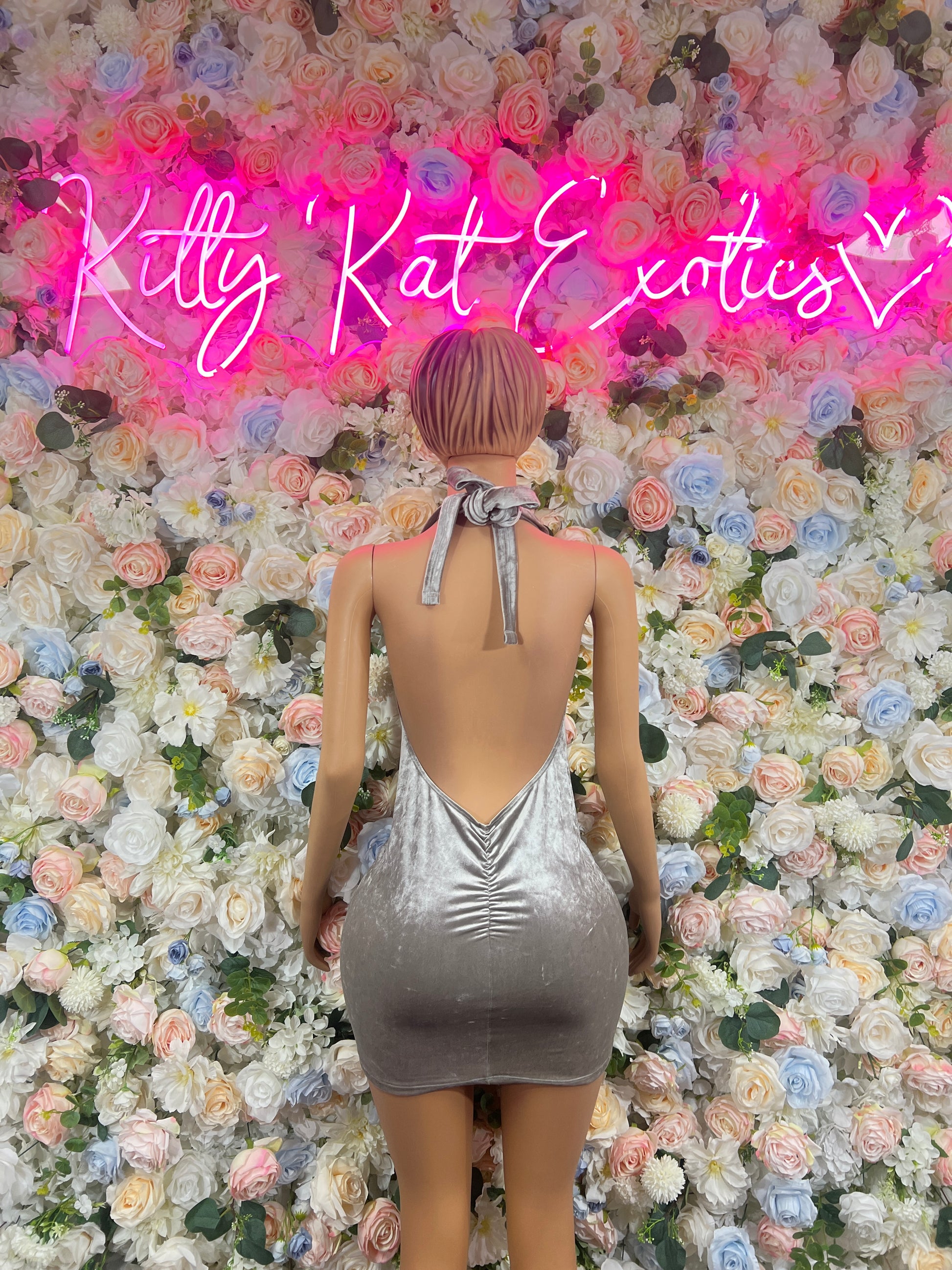 Silver velvet mini dress with open back and tied halter strap