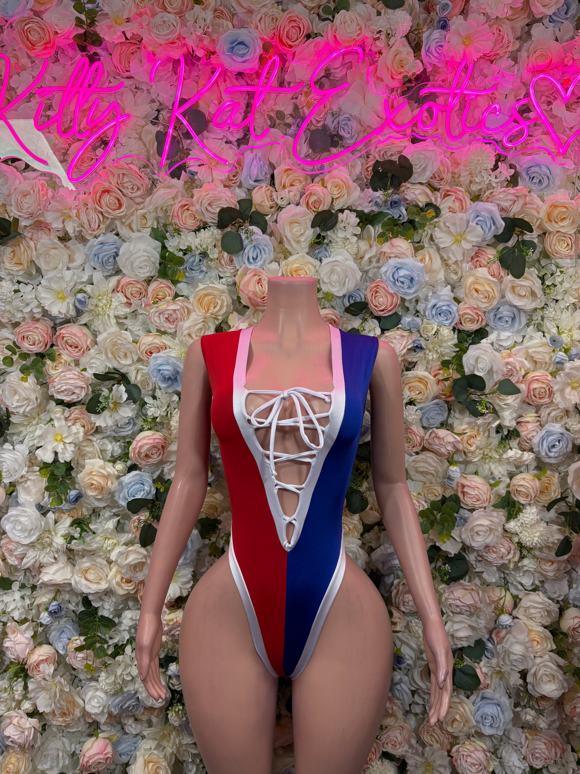 Dominican flag lace-up bodysuit with blue-red-white panels, V neckline, front ties