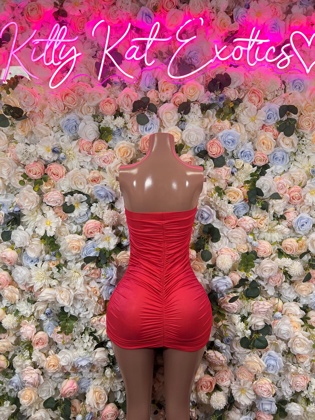 Coral red ruched strapless mini dress with gathered sides, mannequin front view