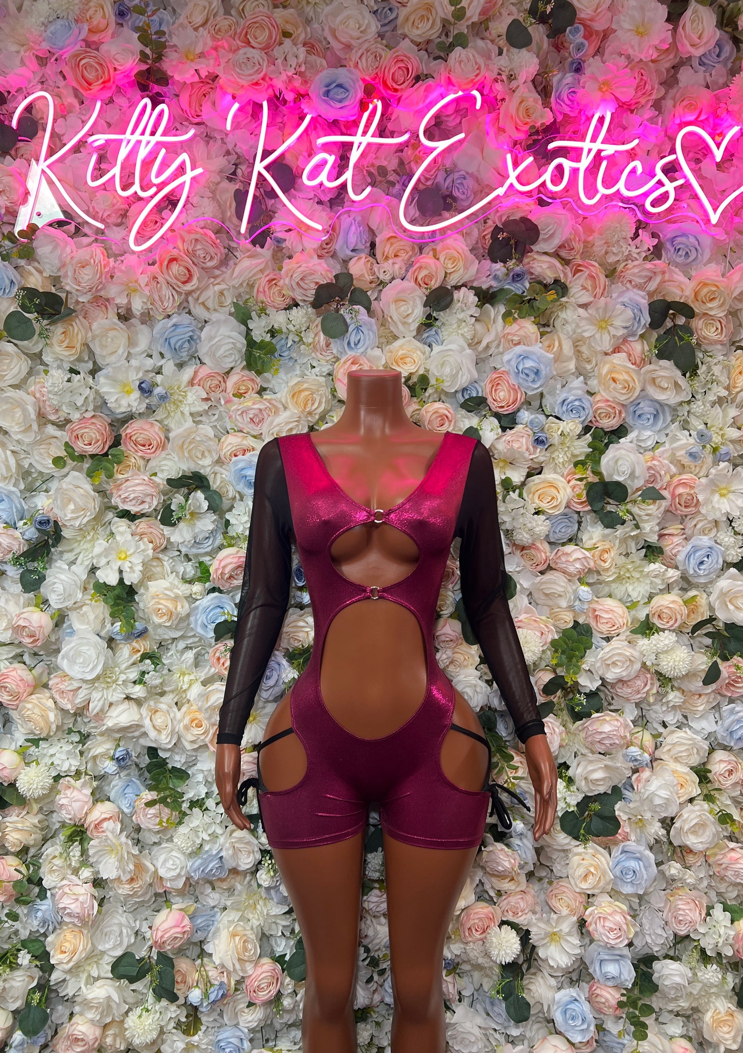 Burgundy mesh bodysuit with long sleeves, lace-up sides, and front cutout
