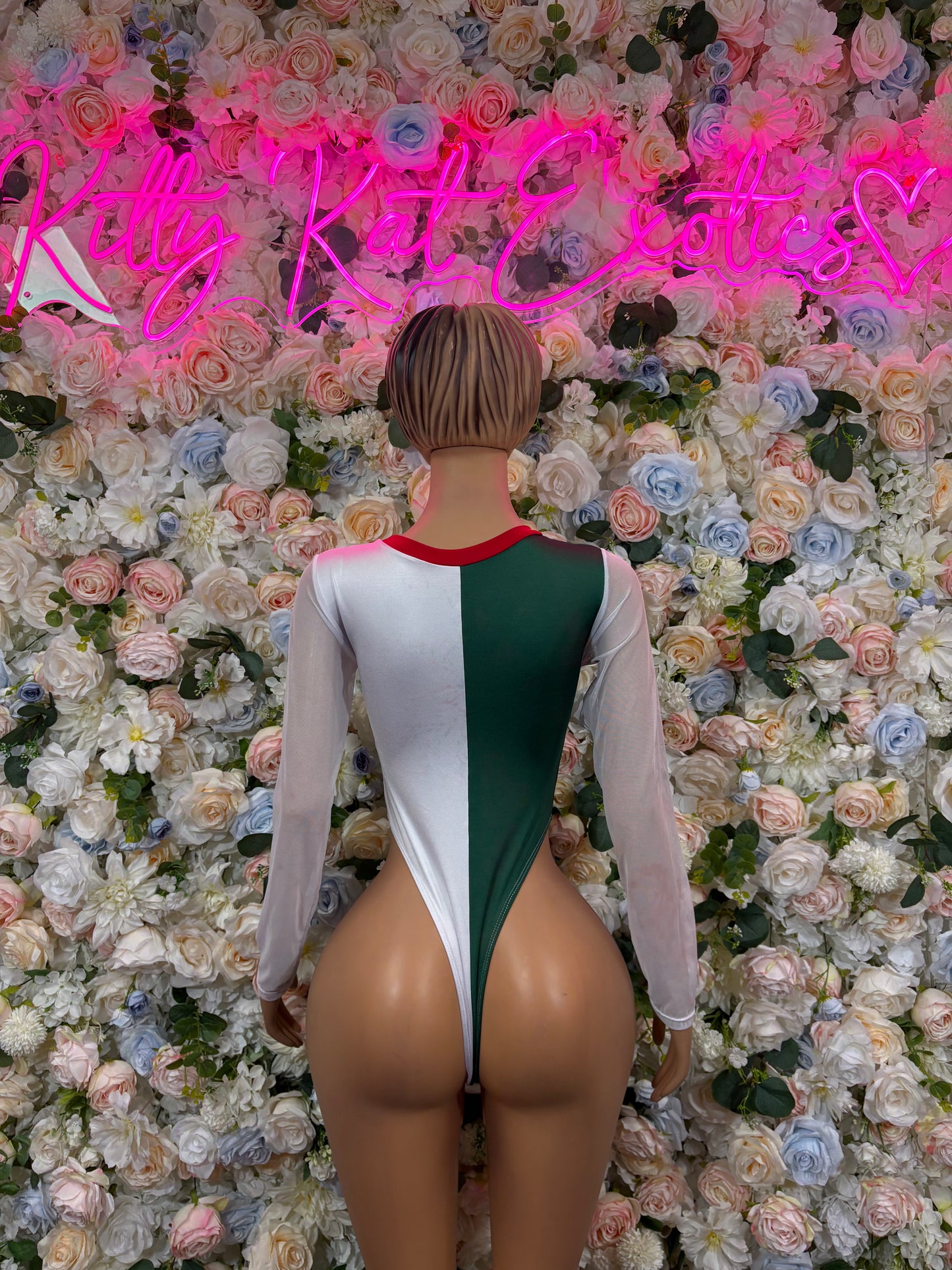 Back view white long-sleeve bodysuit with green center panel and red neckline