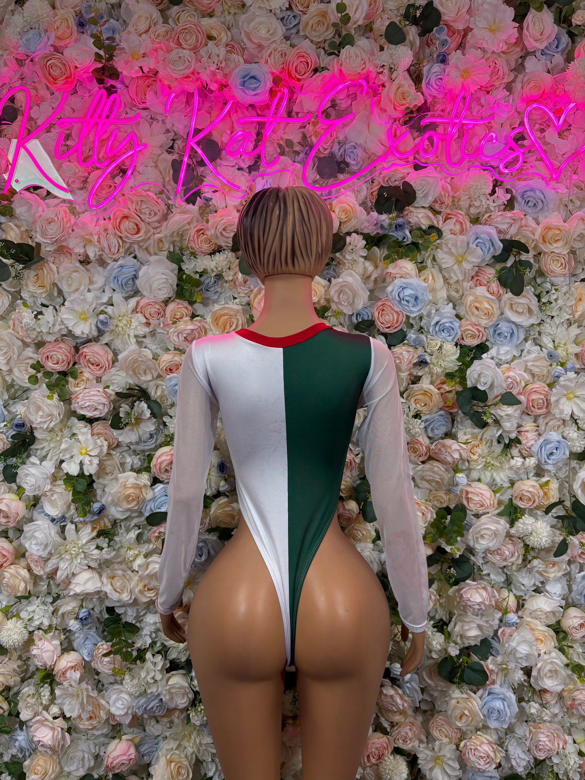 Back view white long-sleeve bodysuit with green center panel and red neckline