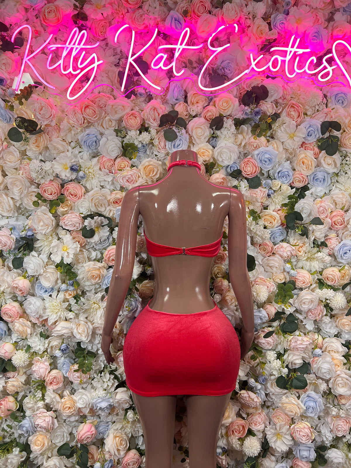 Coral two-piece rave outfit: backless bandeau top and matching mini skirt, thin straps