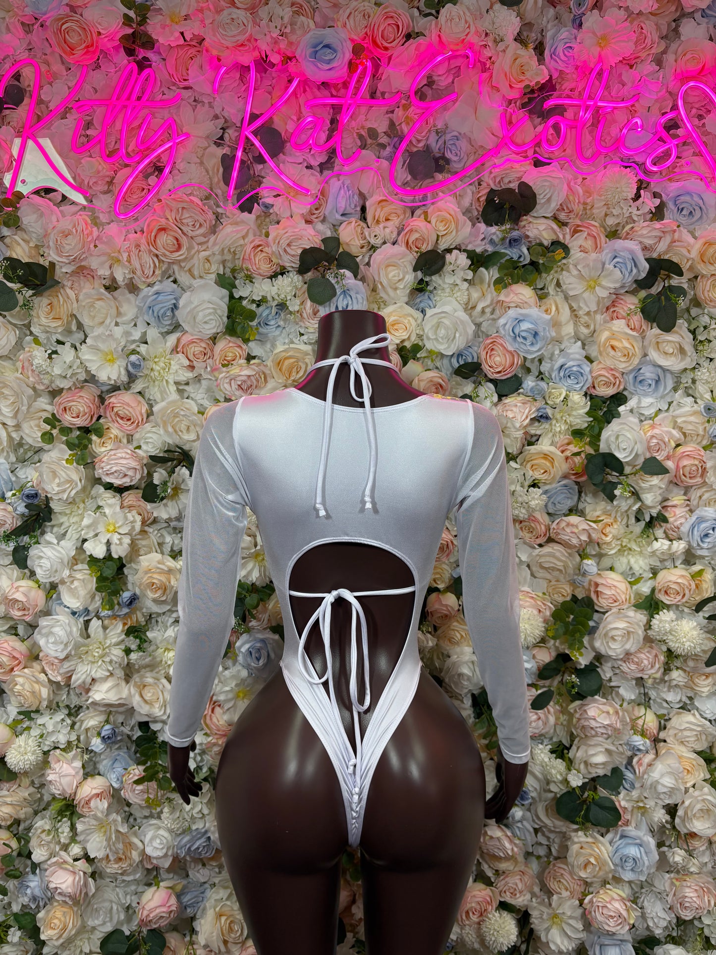 Rainbow hologram backless bodysuit with long sleeves and center lace-up tie