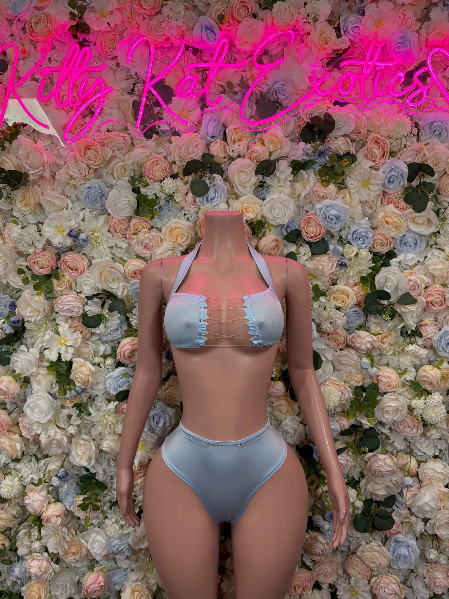 Light blue two-piece rave outfit with lace-up cropped top and high-rise bottoms