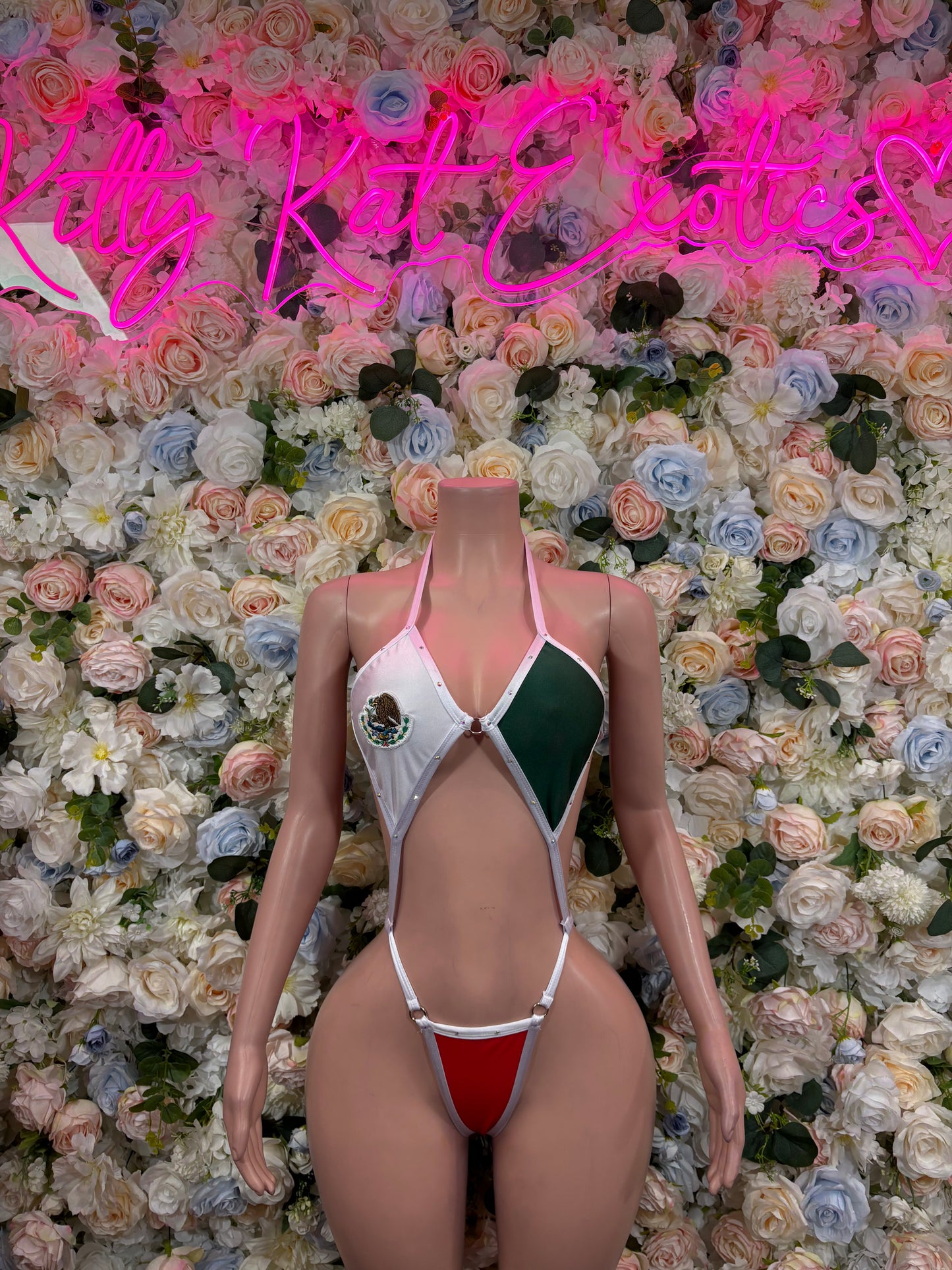 Women’s one-piece swimsuit with red, white, green panels and front cutout straps