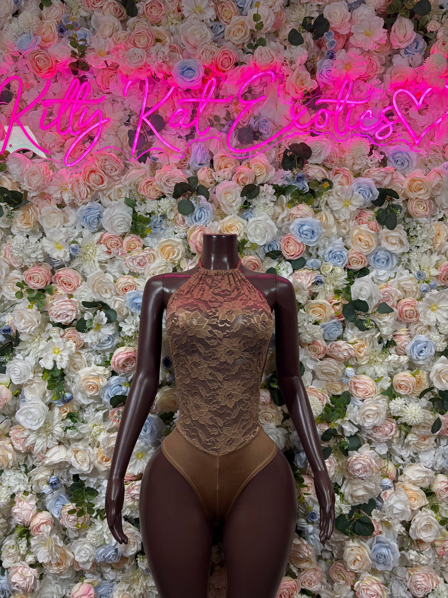Tan lace bodysuit with scoop front and high-cut legs on mannequin