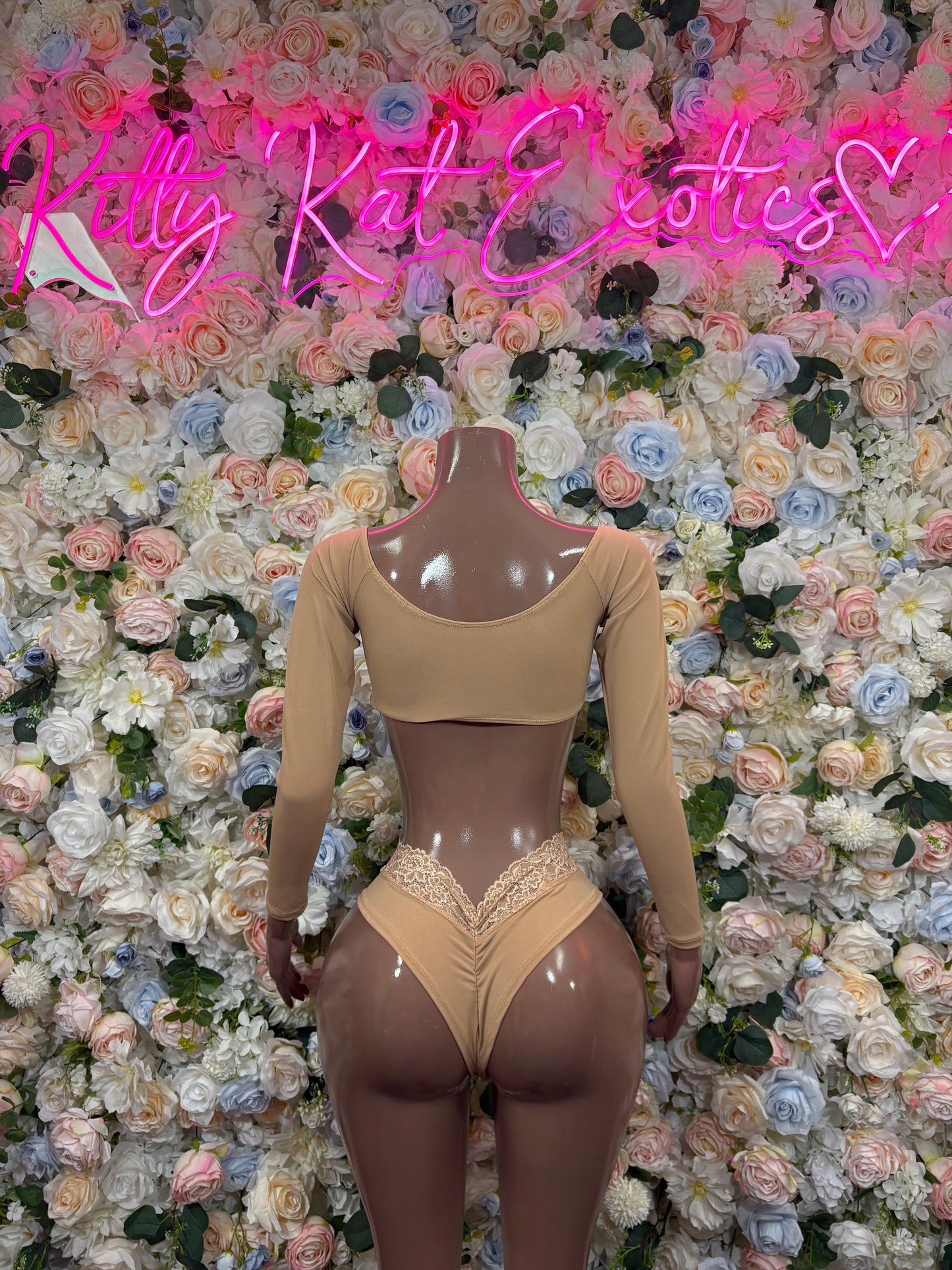 Beige balconette bra and high-leg lace thong-style bottoms on a mannequin