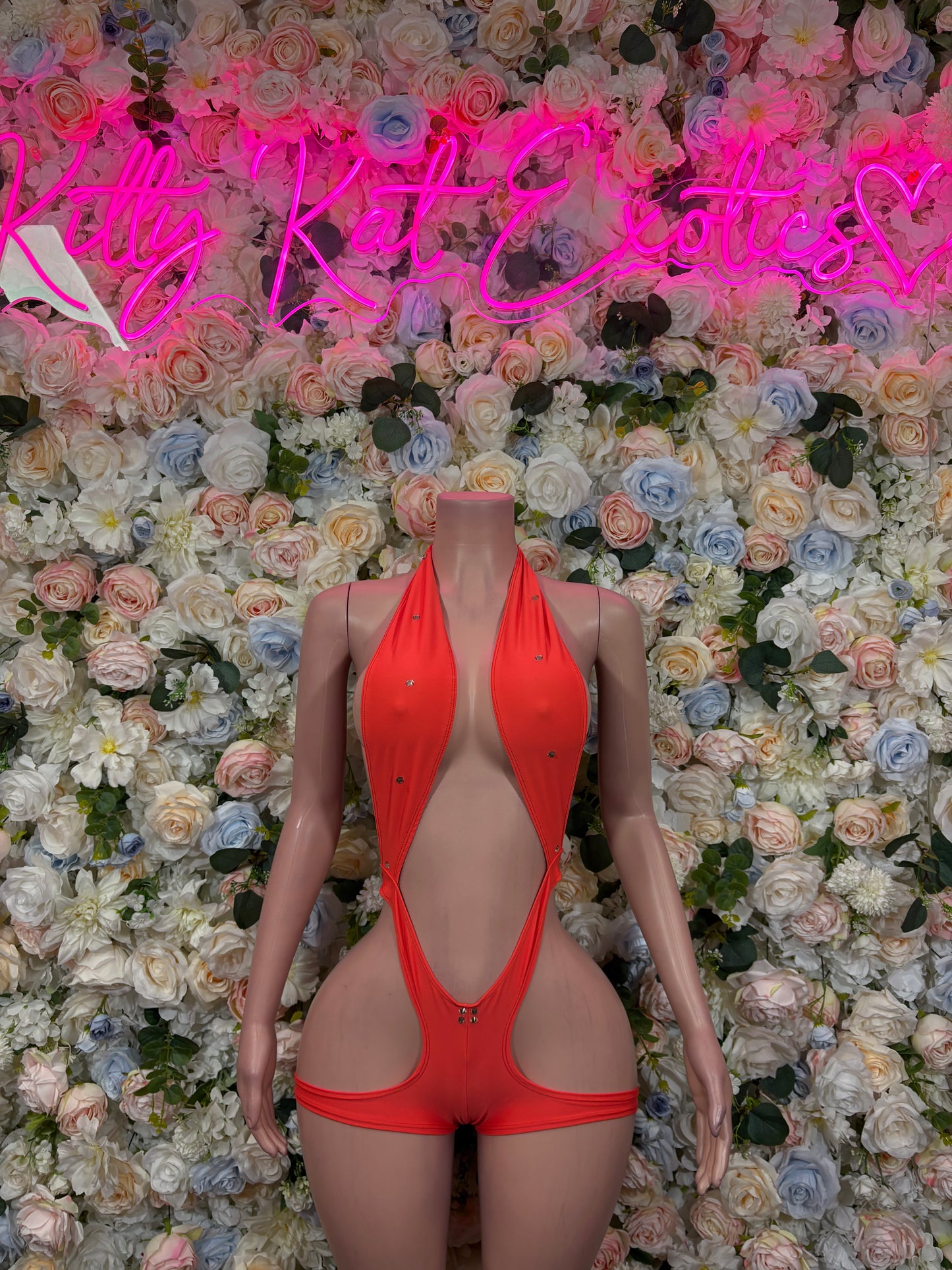 Orange halter one-piece bodysuit with deep V cutout and cheeky coverage