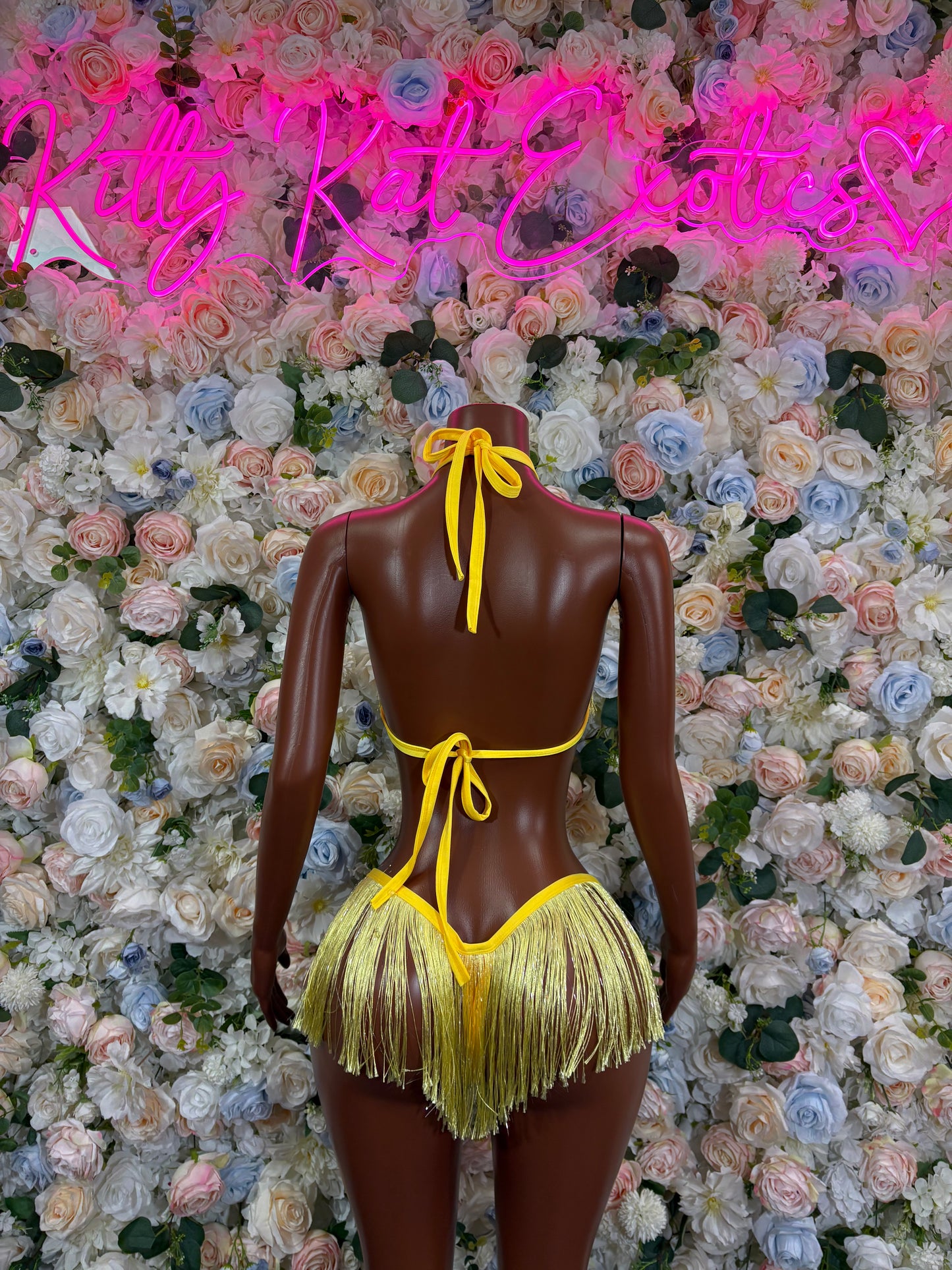 Yellow fringe two-piece festival set, back view: tie halter triangle top and tassel bottoms