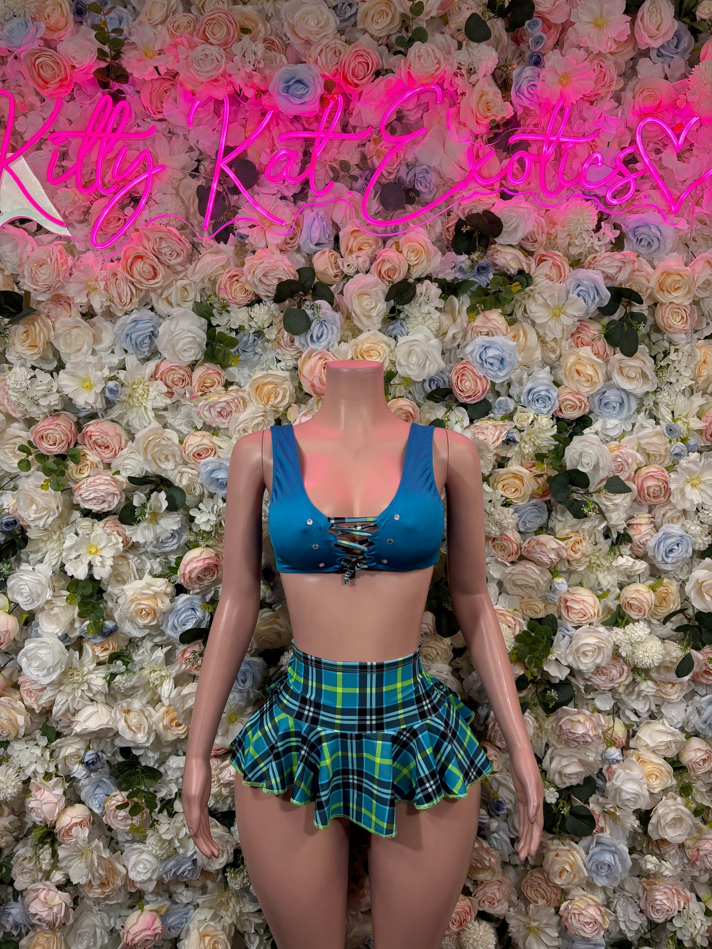 Blue bra top with rhinestone detail and green plaid pleated mini skirt set