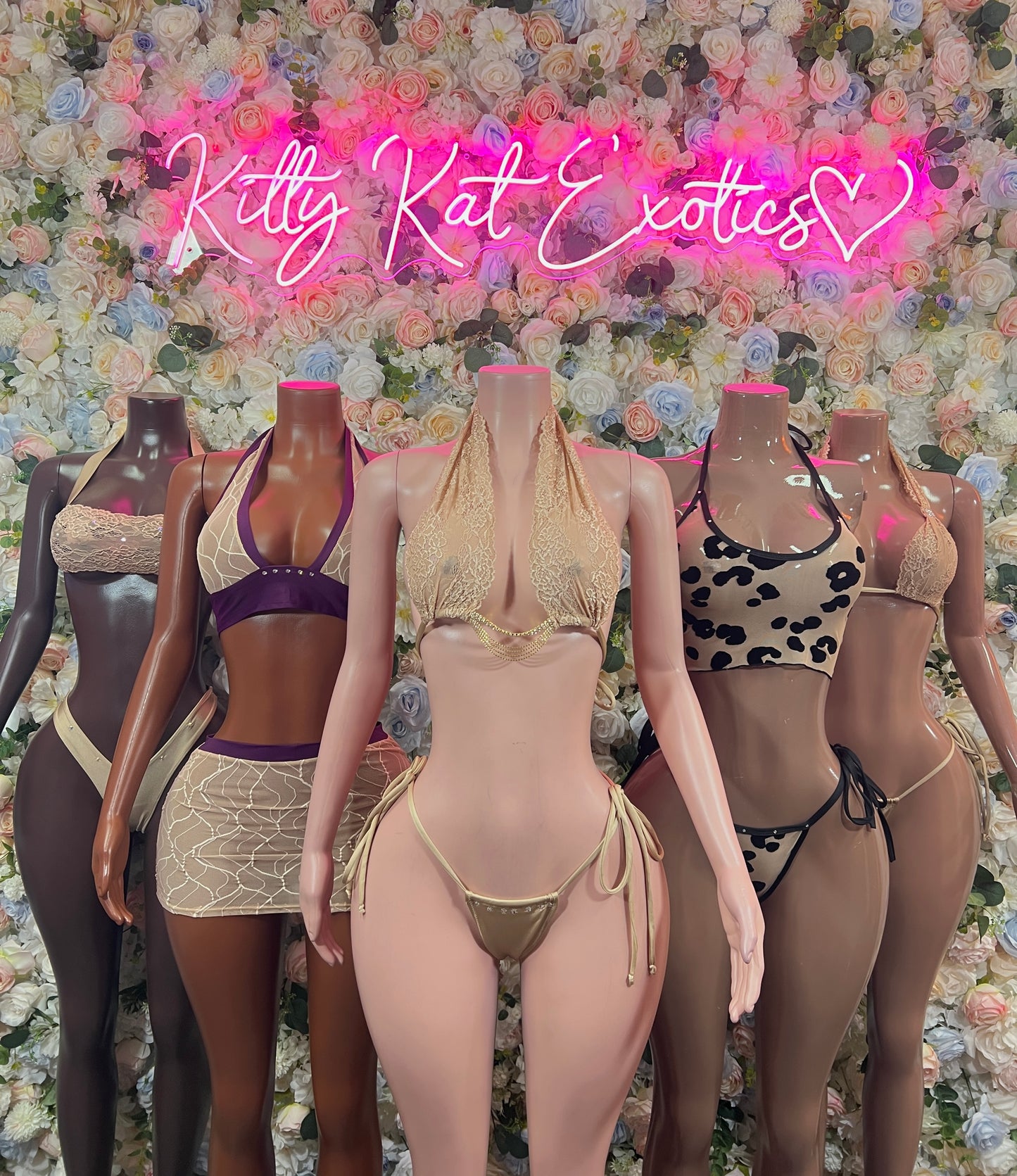 Assorted two-piece bikini sets on mannequins: solid, leopard, and lace-pattern styles
