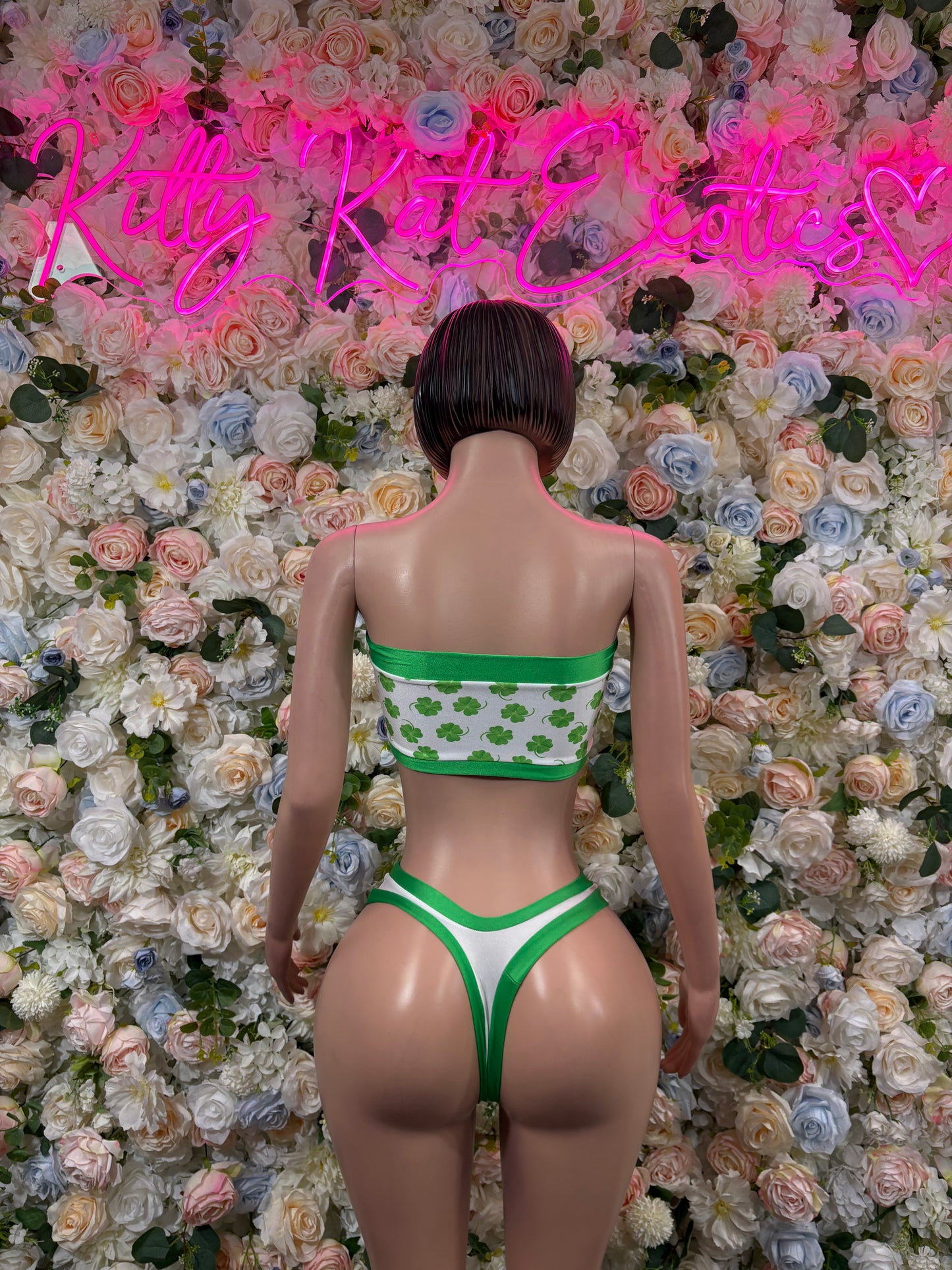 Green shamrock two-piece costume in back view: bandeau top and high-cut briefs