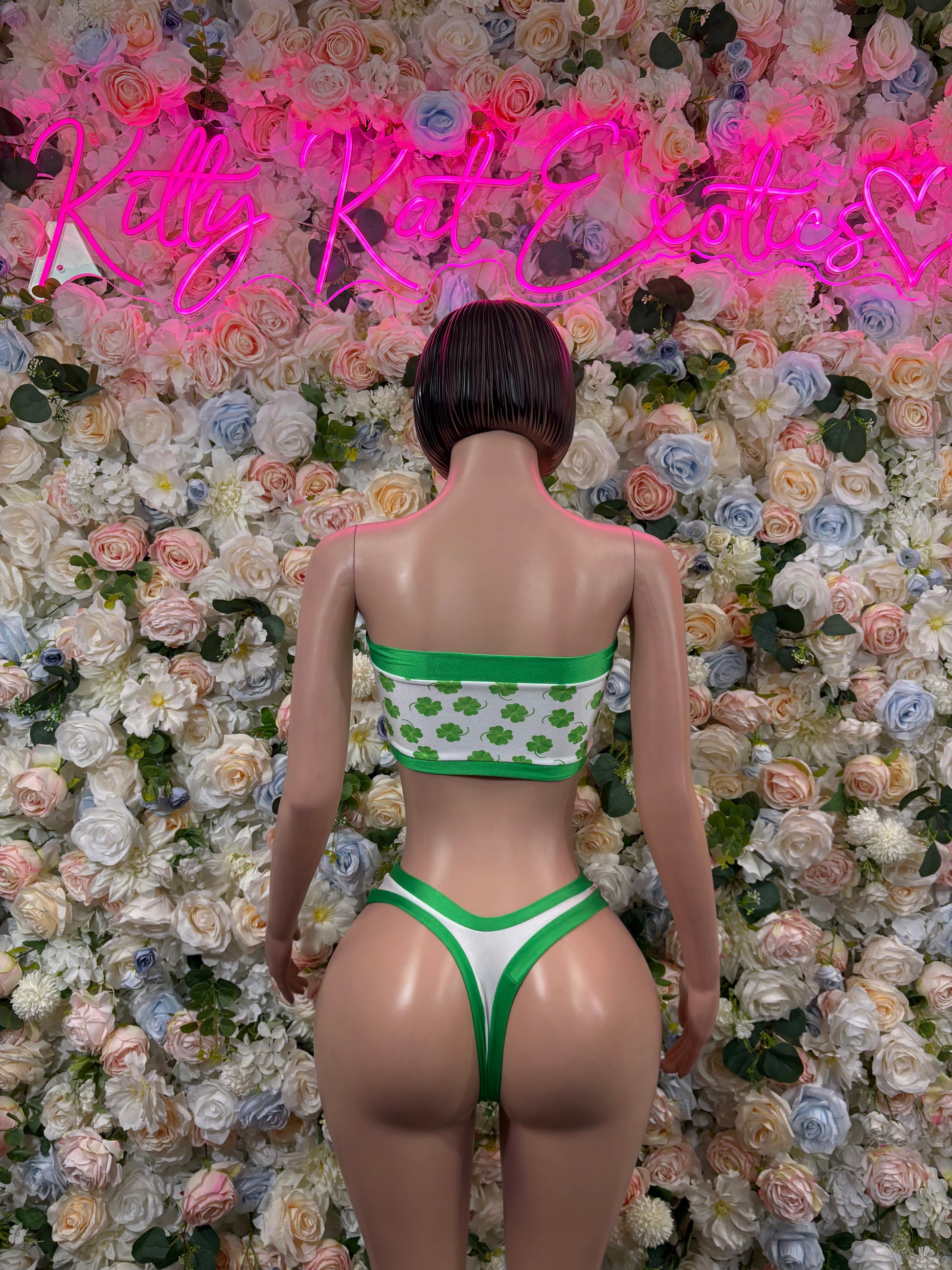 Green shamrock two-piece costume in back view: bandeau top and high-cut briefs
