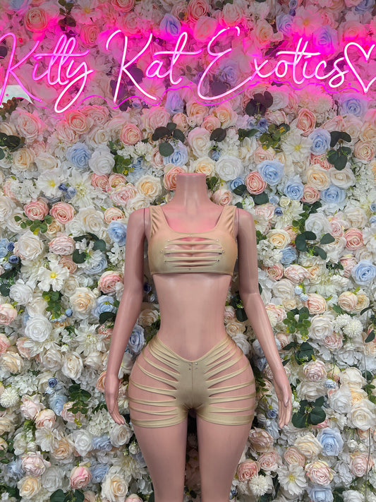 Beige two-piece dancewear set with strappy ruched crop top and matching shorts