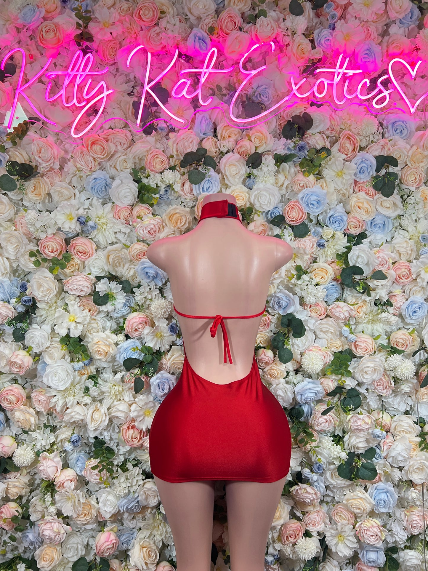 Red halter bodycon dress with open back and tie bow