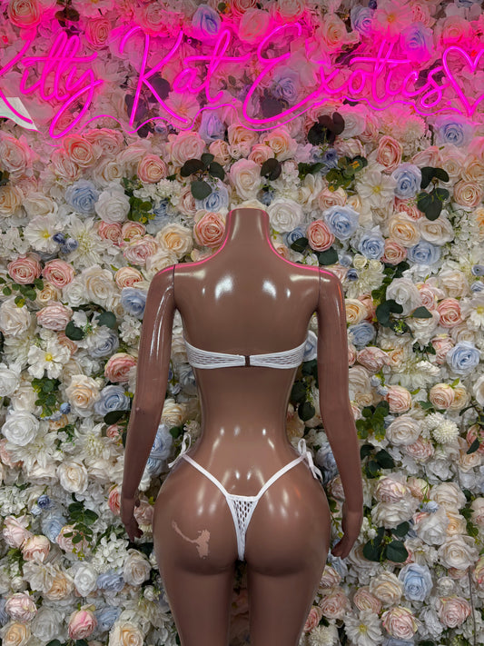 White bikini set with lace-up triangle back and strappy thong-style bottoms on mannequin