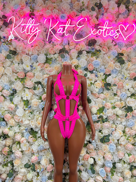 Pink strappy bodysuit with high-cut legs and front cutout