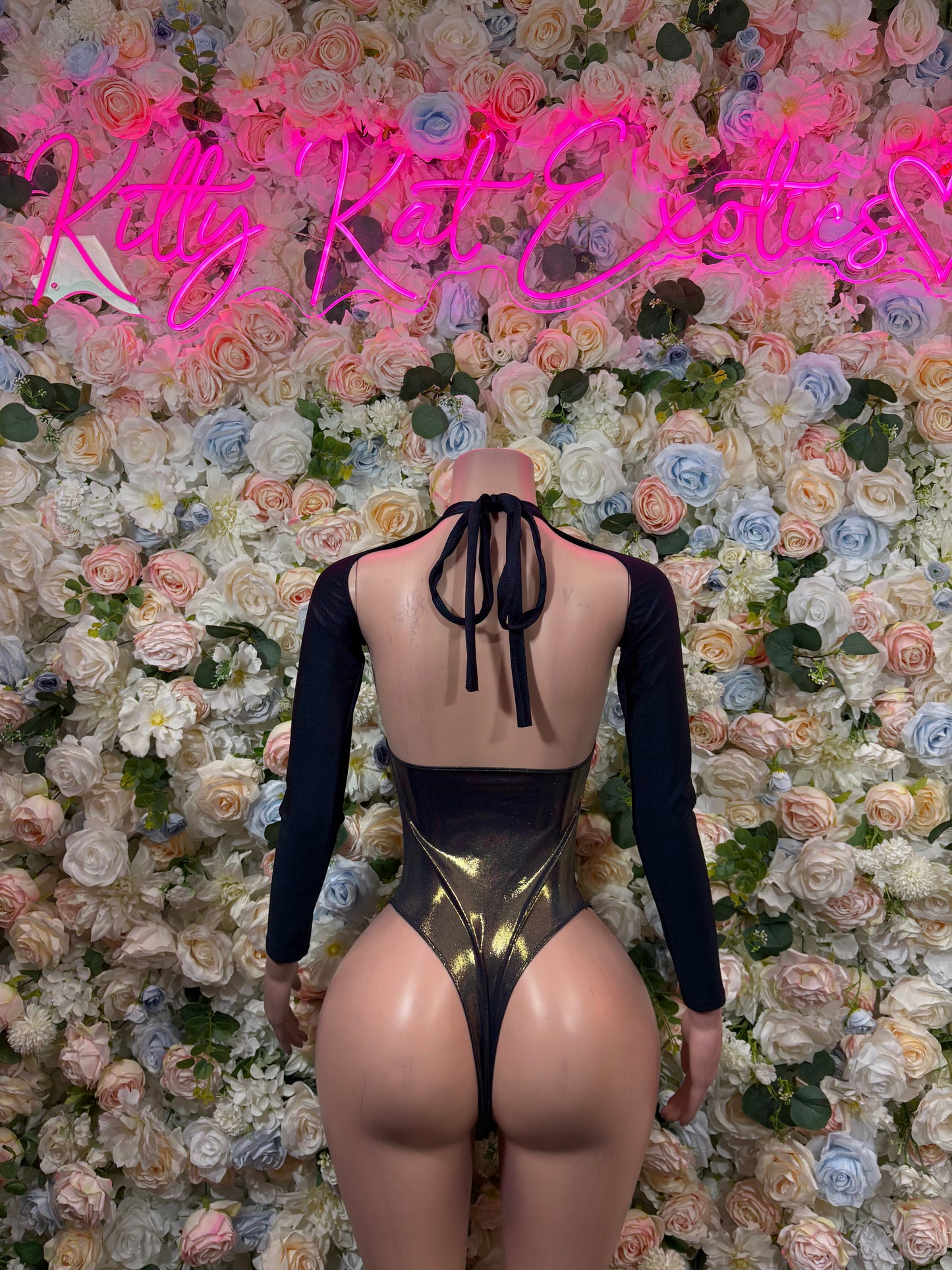 Backless bodysuit with tie straps, long sleeves, and metallic gold back panel