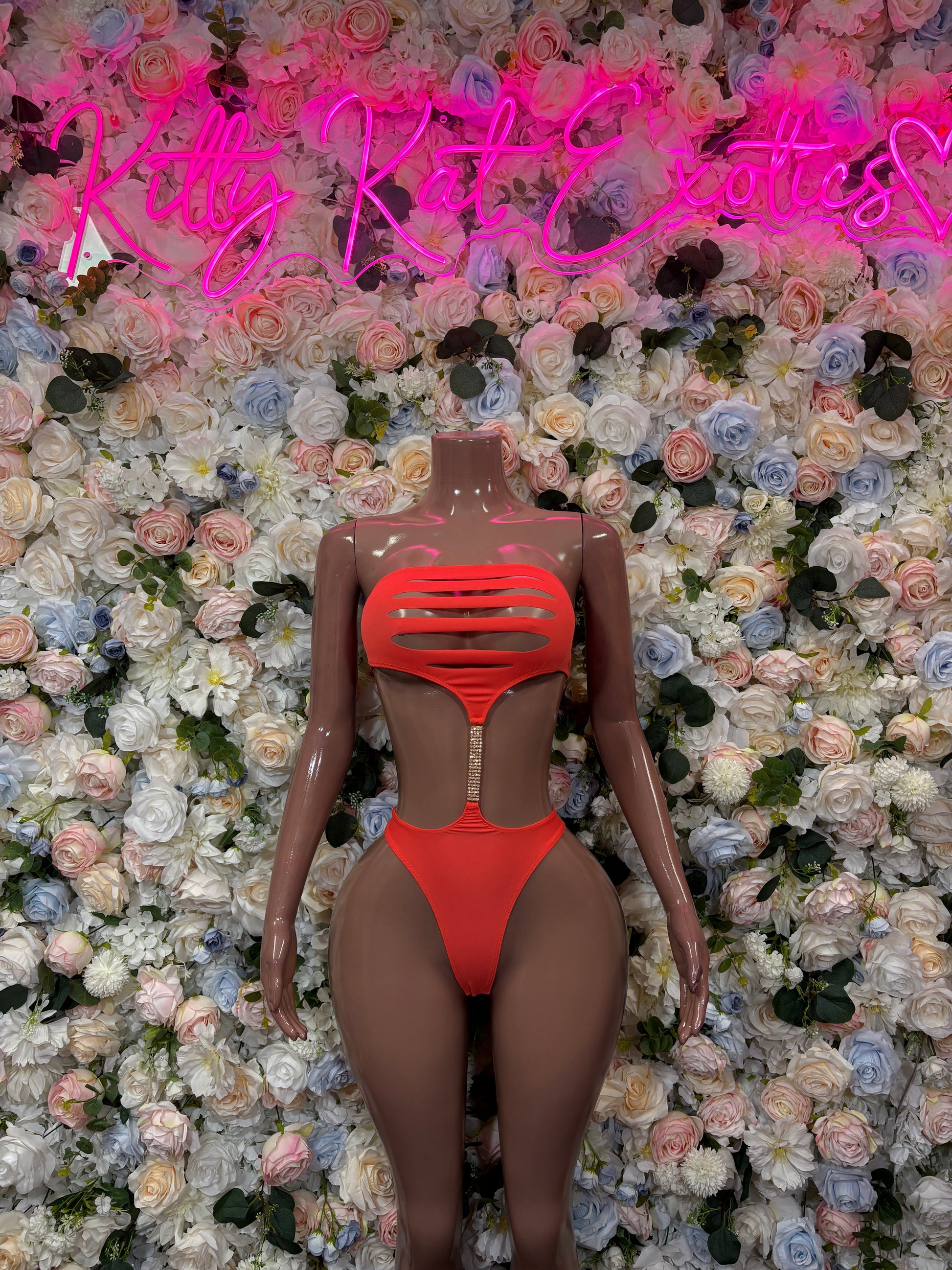 Two-piece swimsuit set in orange with high-cut bottoms and strappy back