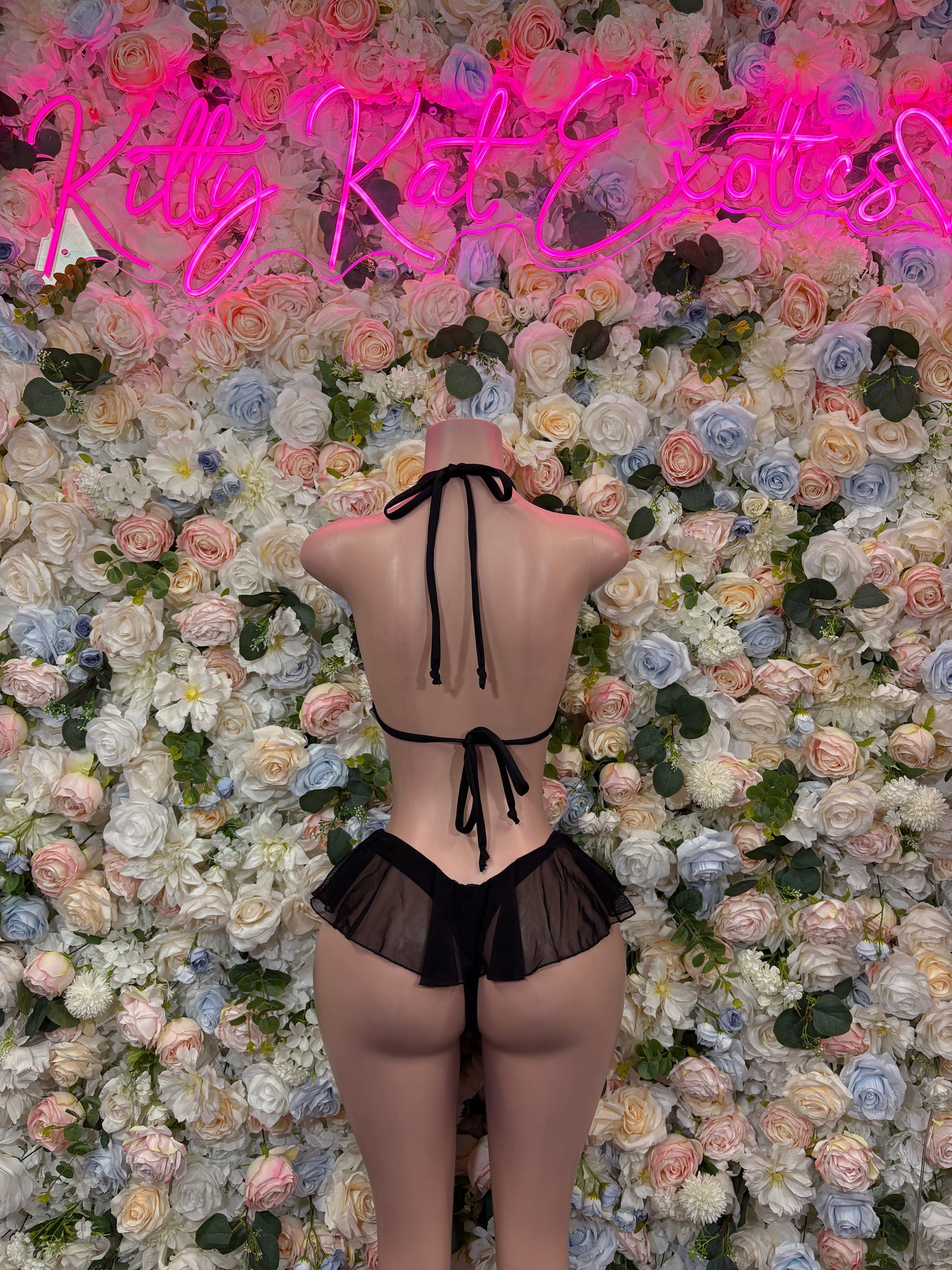 Black bikini set, back view, with string tie straps and ruffled bottom