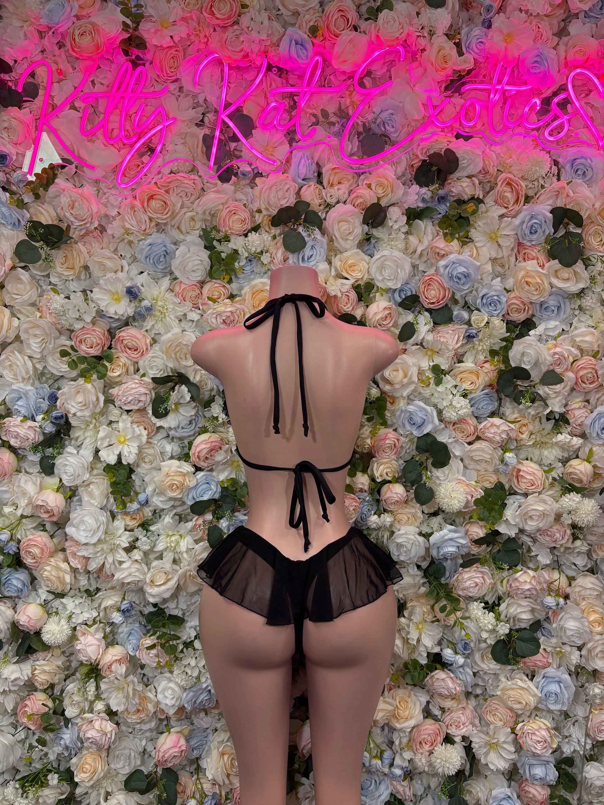 Black bikini set, back view, with string tie straps and ruffled bottom
