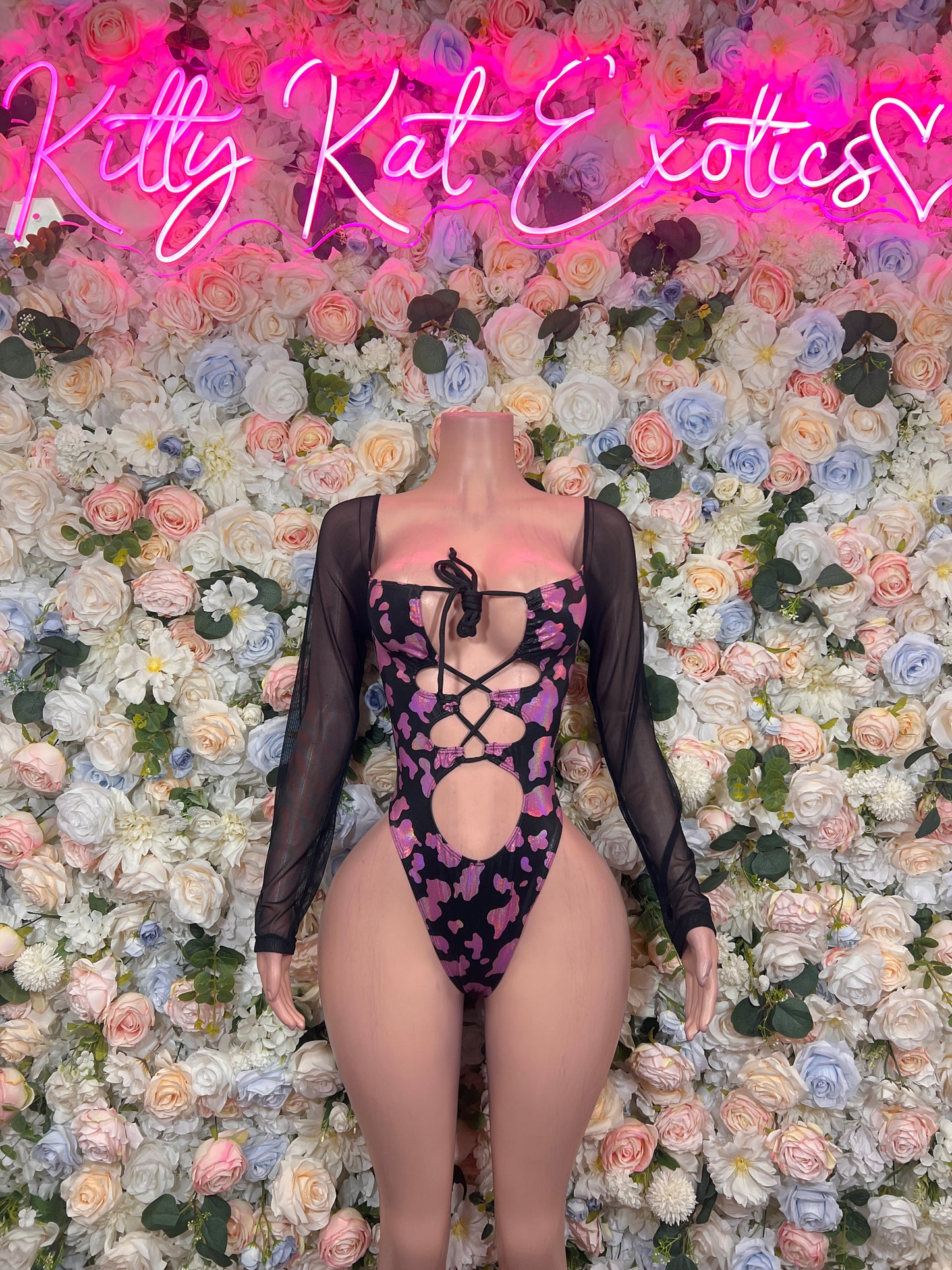 Black sheer long-sleeve bodysuit with front lace-up, high-cut legs and pink print
