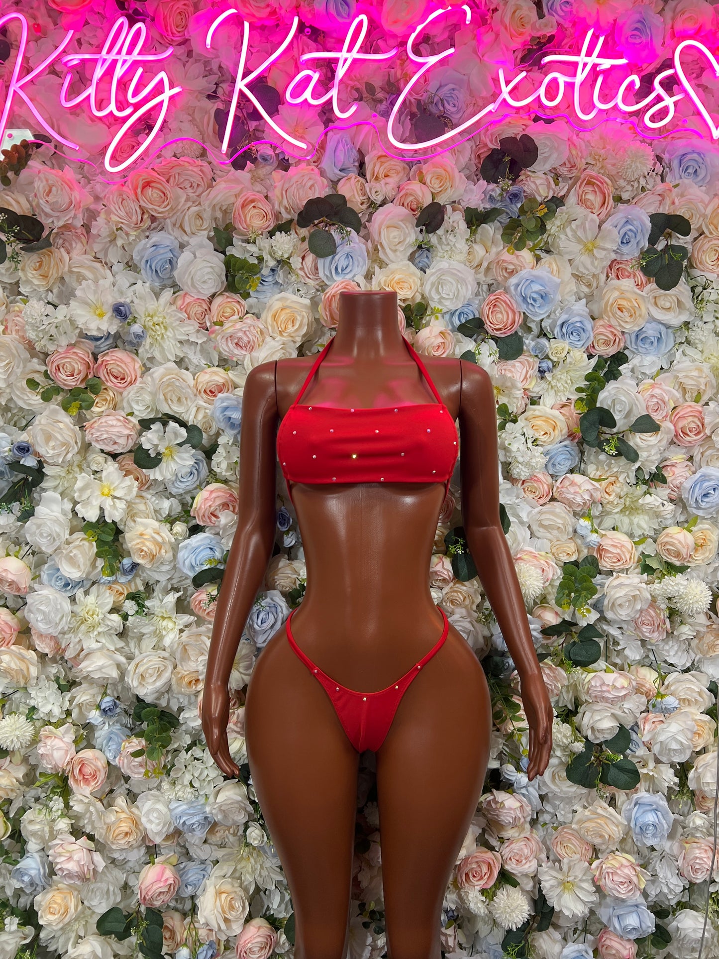 Red string bikini two-piece with ruched crop top and matching string hip bottoms