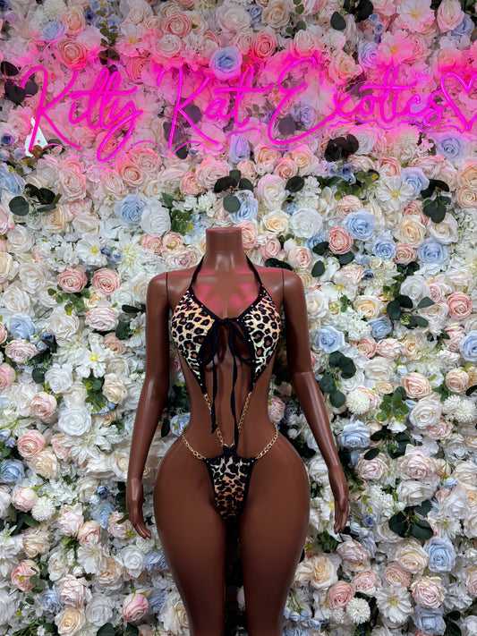 Leopard print two-piece bodysuit with black lace-up front and high-cut bottoms
