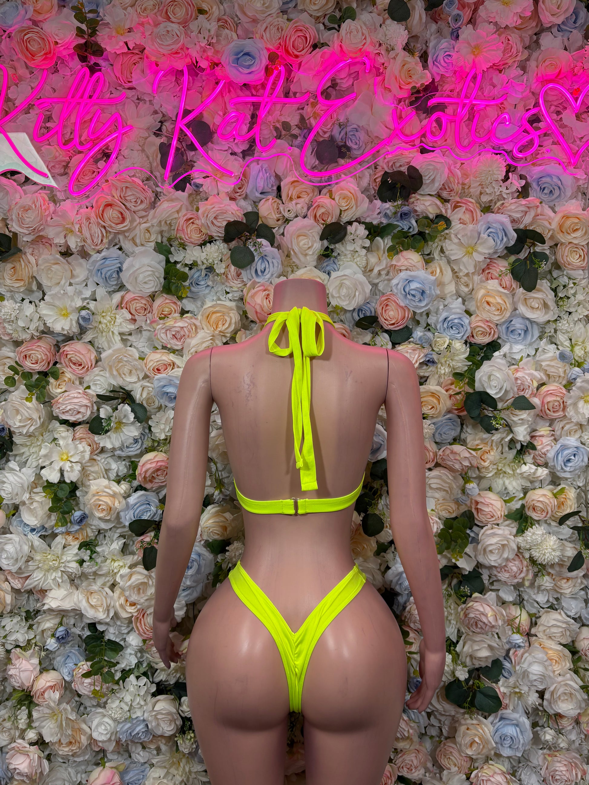 Neon green halter bikini set with back-tie straps and high-cut bottoms