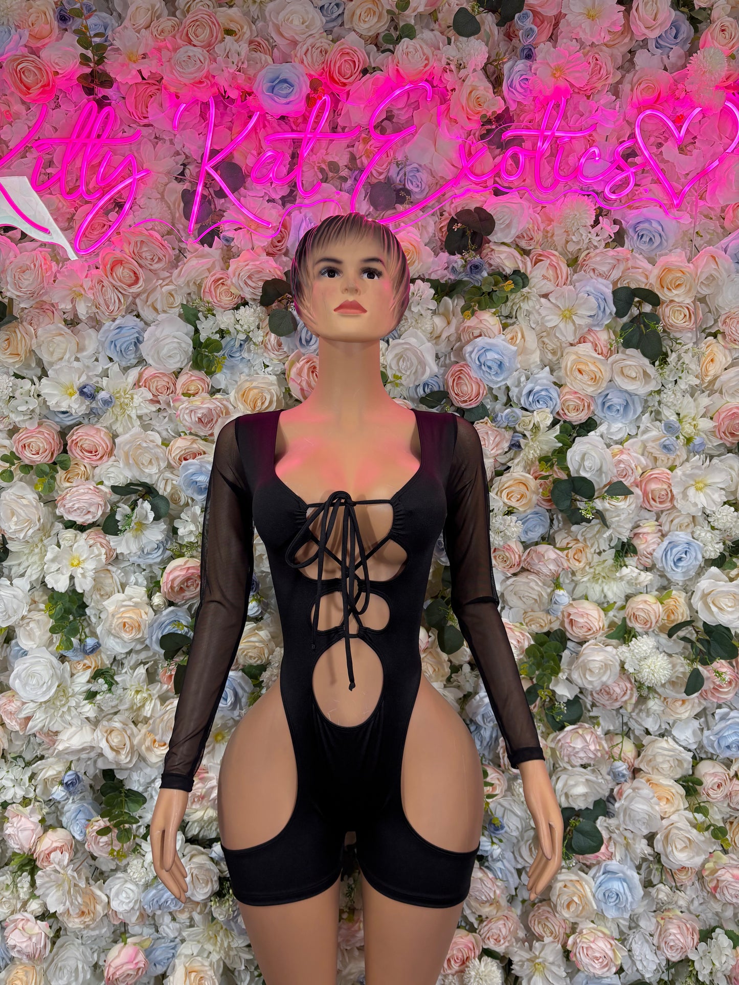 Black long-sleeve bodysuit with lace-up front and cheeky leg cutouts