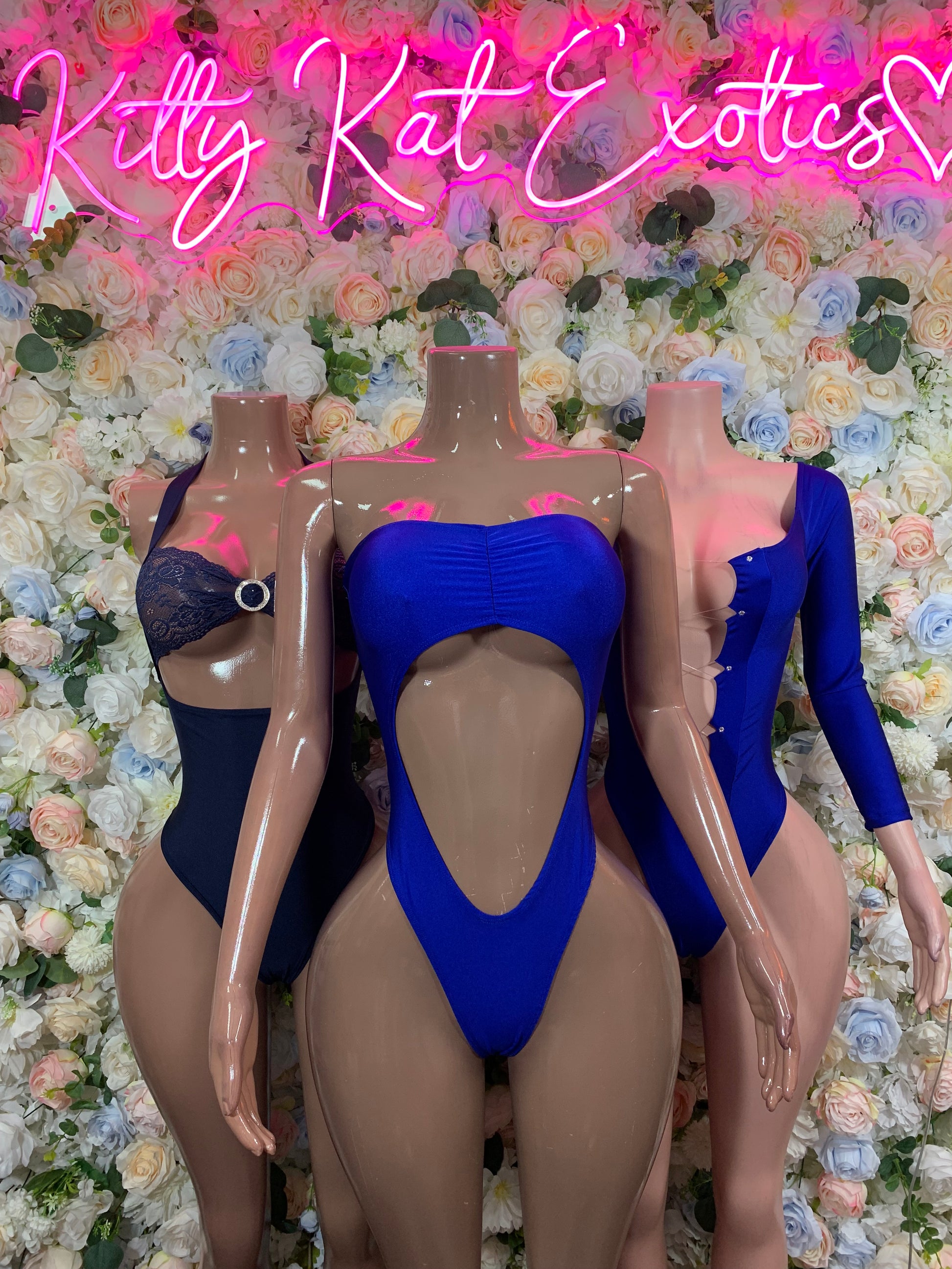 Blue long-sleeve one-piece bodysuit on mannequin with high-cut leg