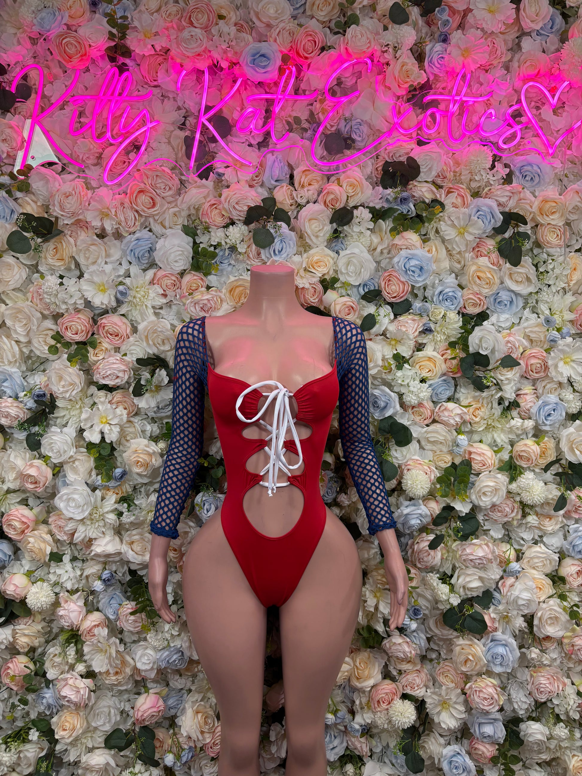 Red lace-up bodysuit with blue mesh sleeves and chest cutout