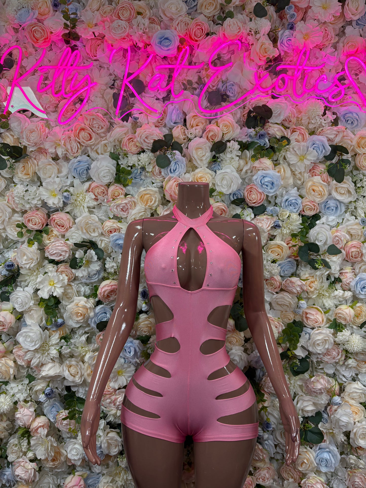 Pink cutout rave bodysuit with halter neckline and long sheer sleeves