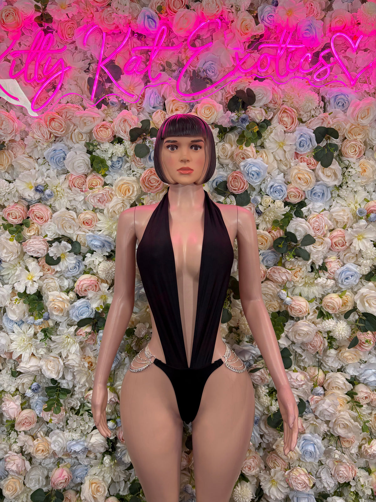 Black halter slingshot bodysuit with deep V front and cheeky cut