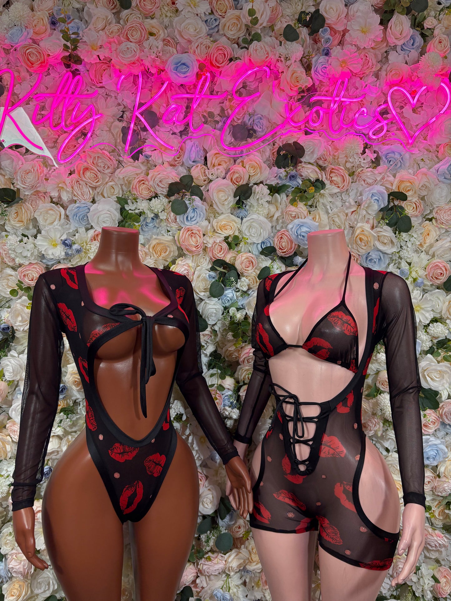 Black sheer bodysuit with red kiss heart print, crisscross straps, and open back
