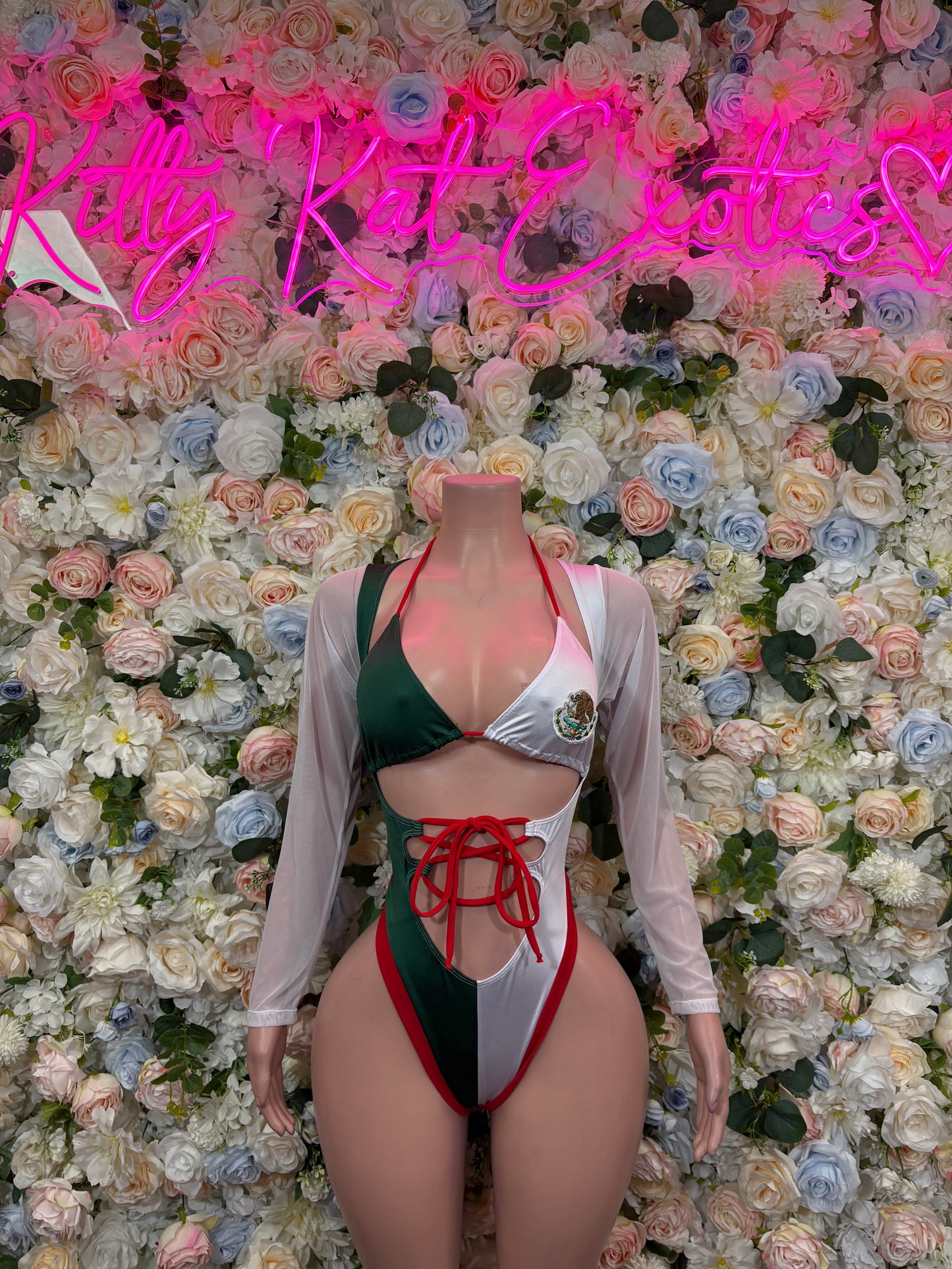 One-piece bikini bodysuit, green and white with red lace-up front, long sleeves