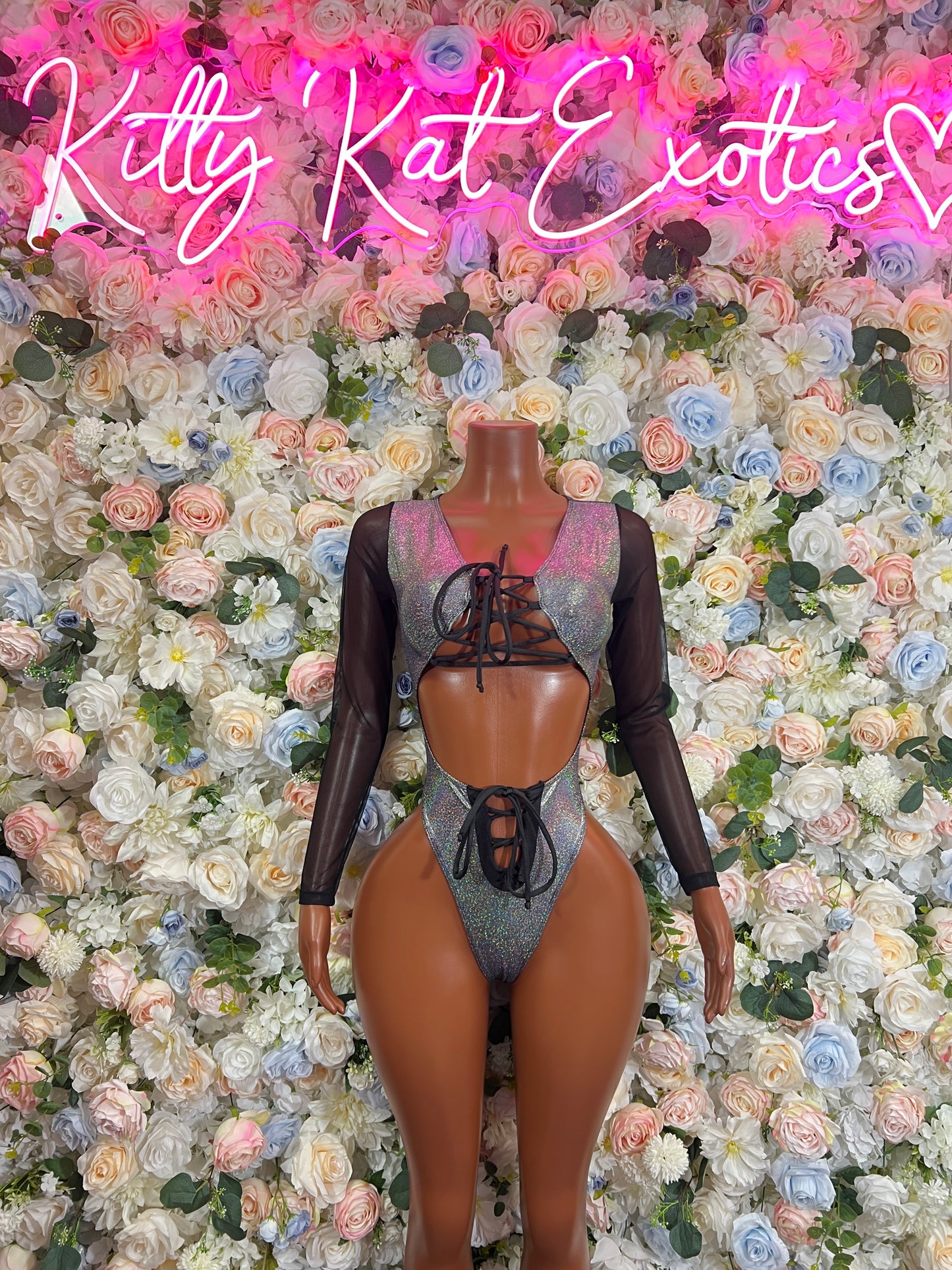 Silver metallic bodysuit with long sheer sleeves, lace-up front and thong-style bottom