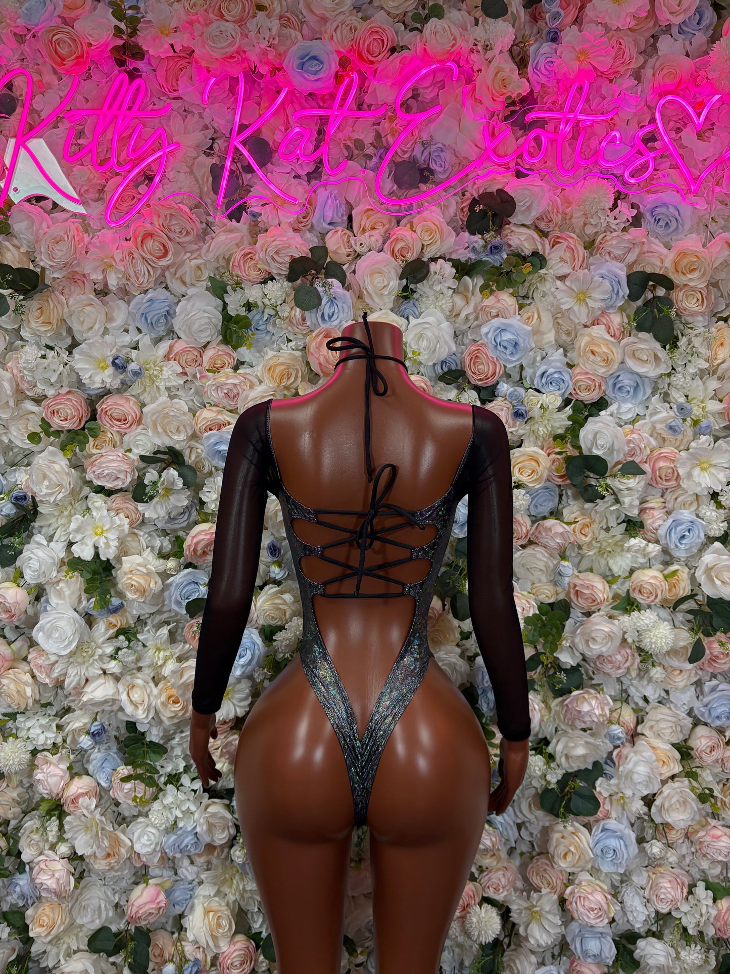 Black long-sleeve metallic bodysuit with crisscross lace-up back cutouts