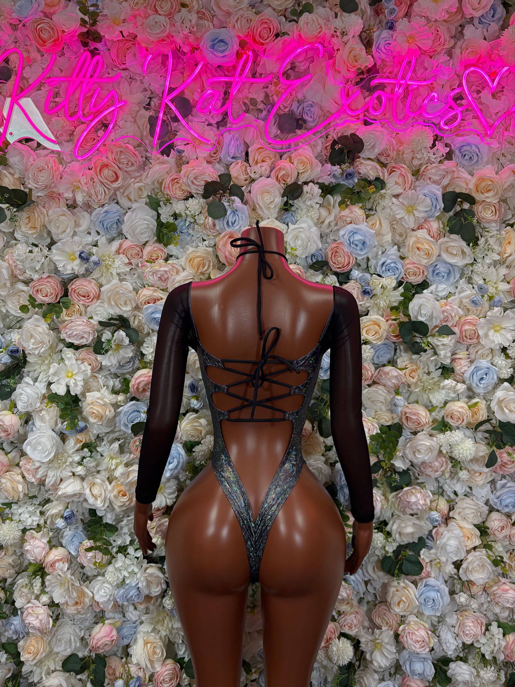 Black long-sleeve metallic bodysuit with crisscross lace-up back cutouts