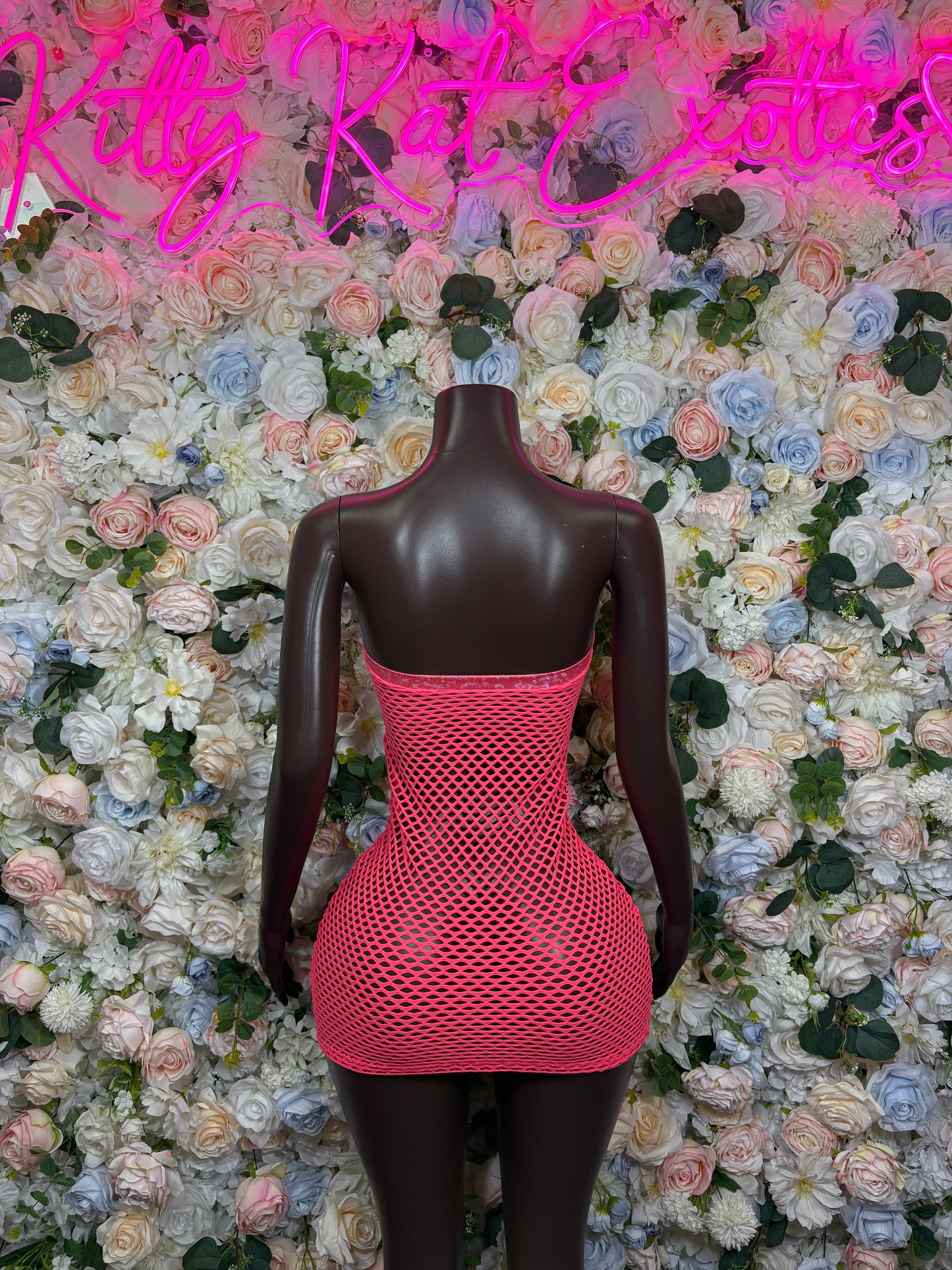 Coral fishnet corset dress with open back and lace-up front detail