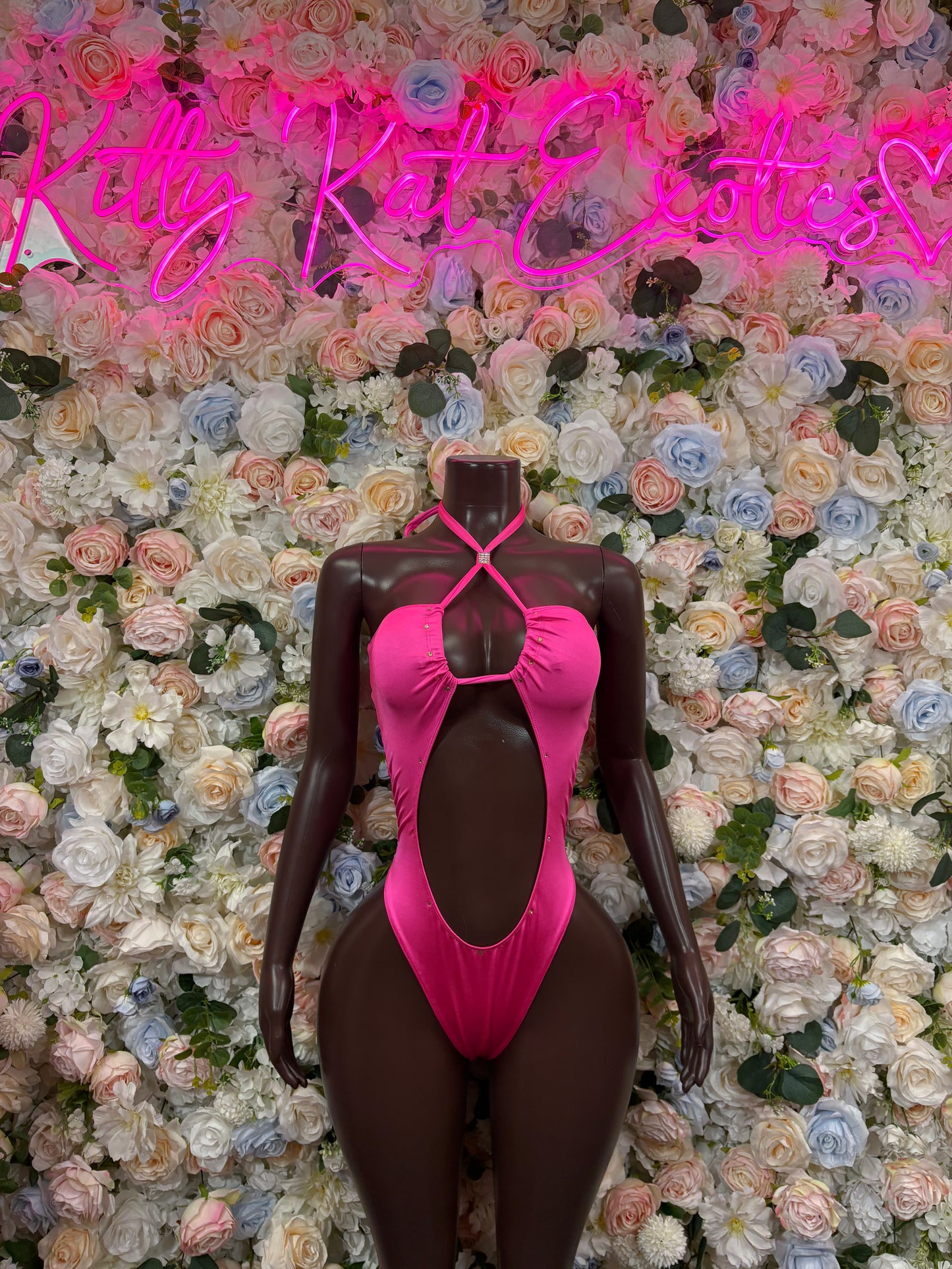 Pink bodysuit with halter straps and deep oval cutout front