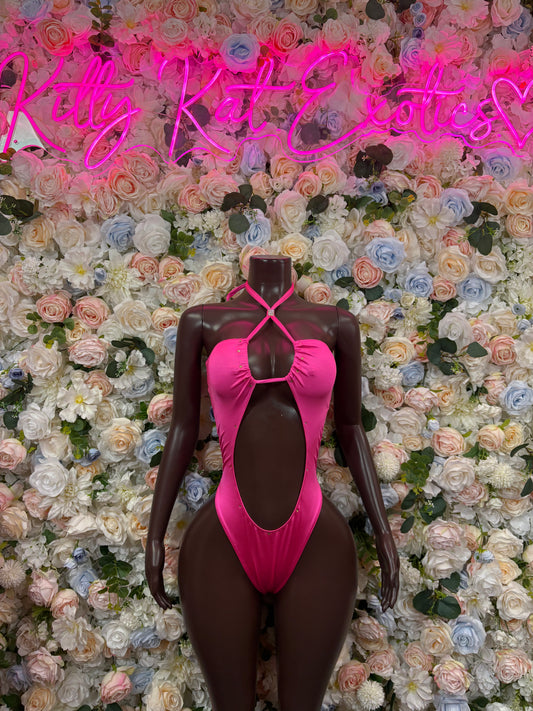 Pink bodysuit with halter straps and deep oval cutout front