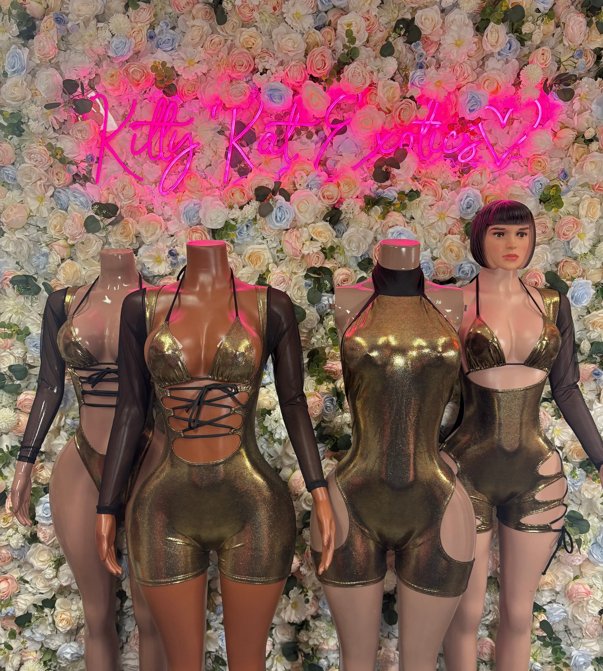 Gold metallic strappy bodysuit on mannequins with cutout design