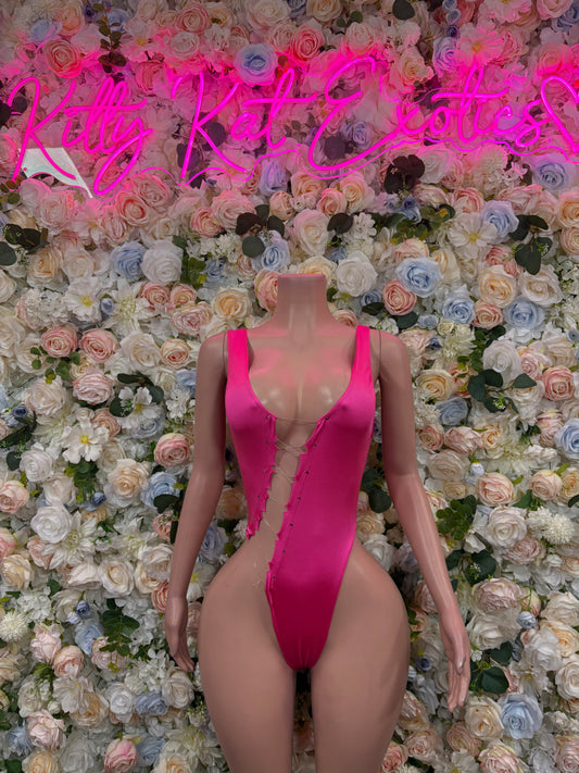 Hot pink one-piece dancewear bodysuit with deep V neckline and front cutouts