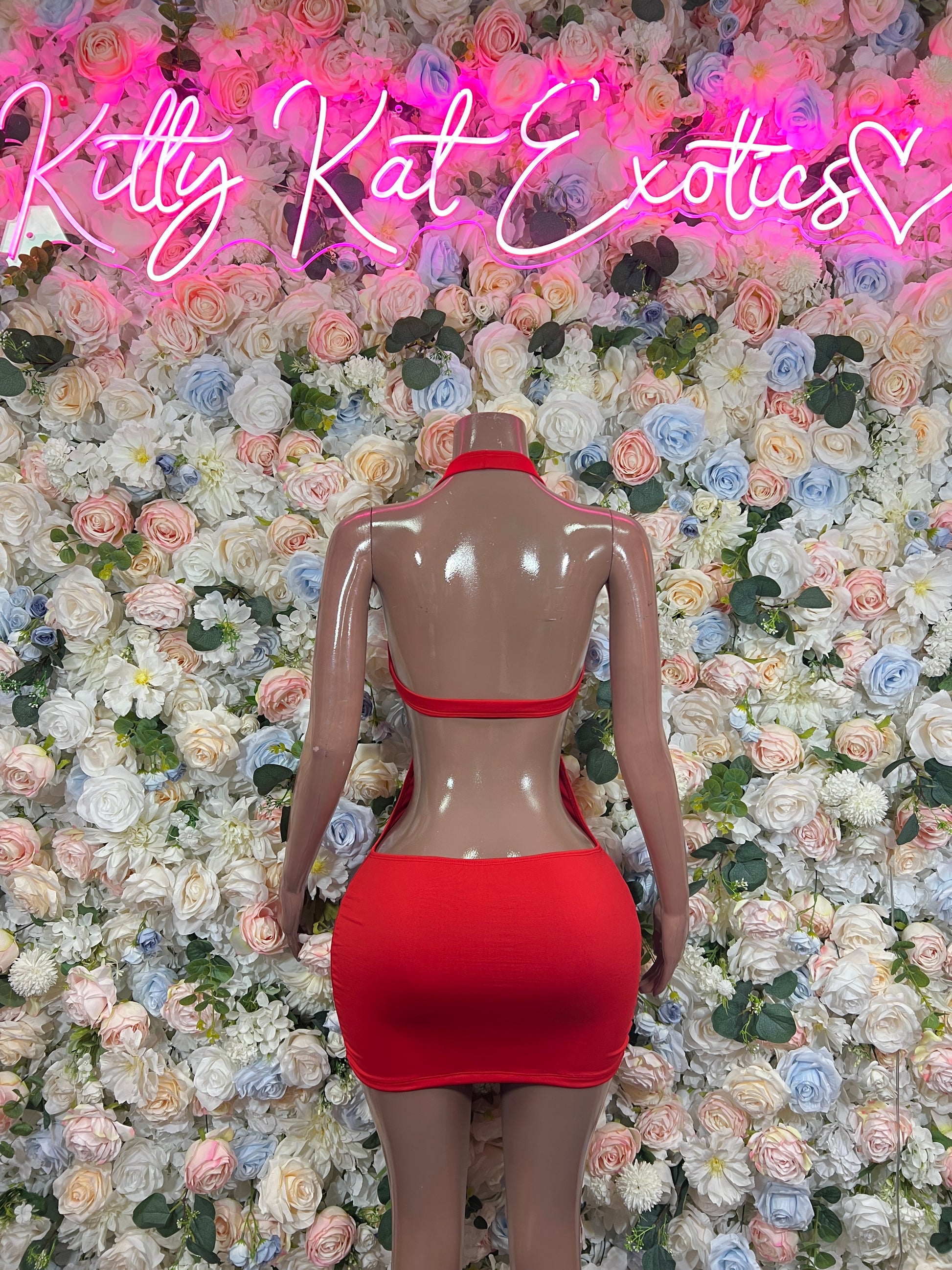Red backless halter bodycon mini dress with strappy open-back design