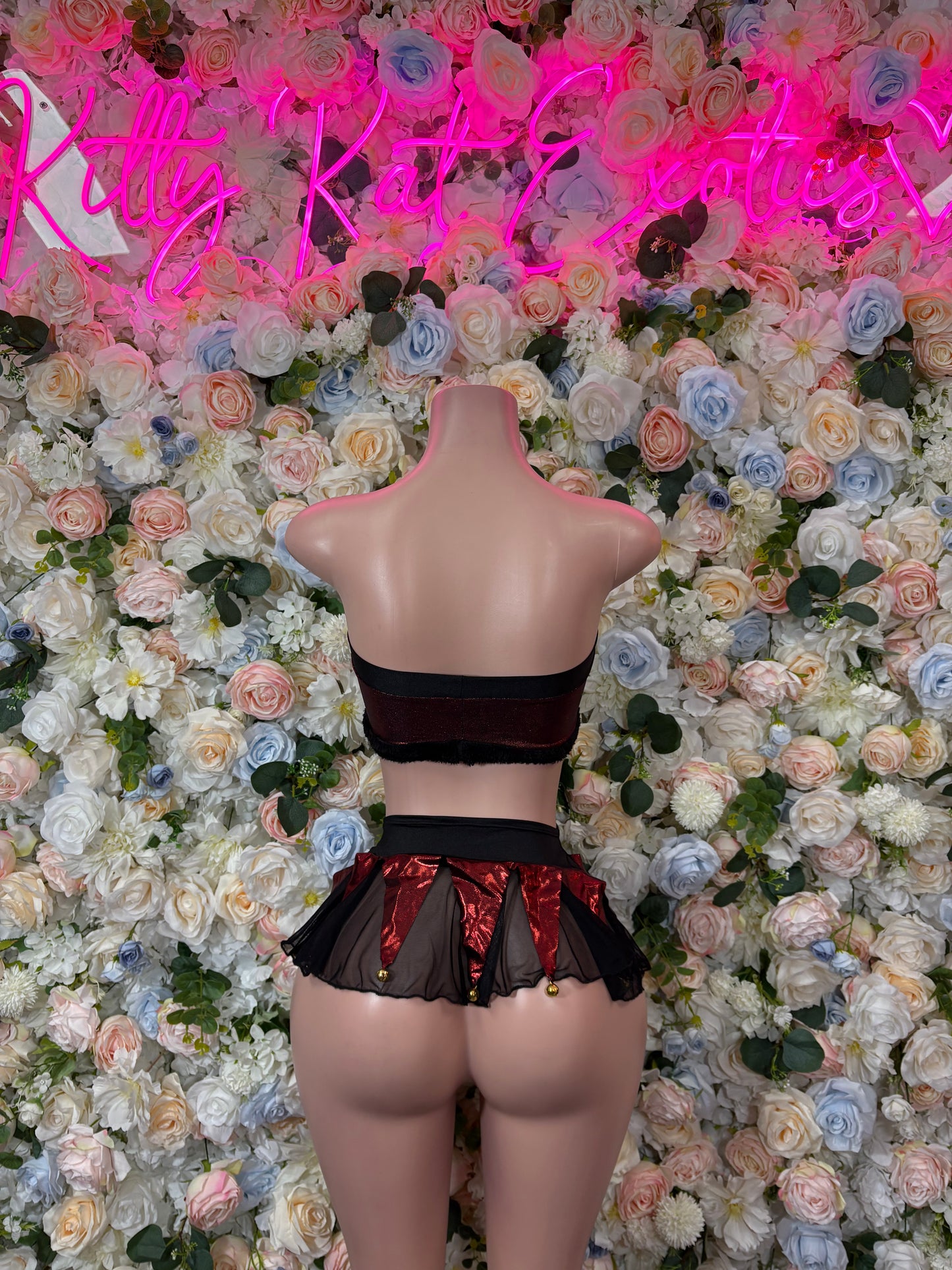 Women’s holiday bartender skirt set: black backless crop top, burgundy ruffle mini skirt.